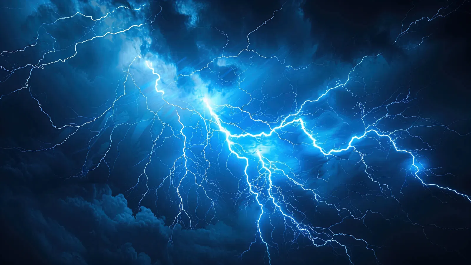 Dramatic blue lightning illuminating dark storm clouds in a striking weather scene.