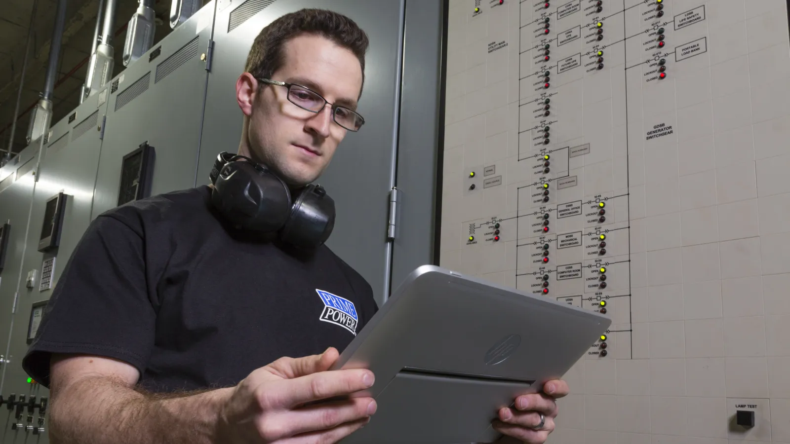 a man holding a laptop