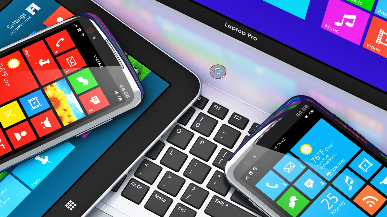 Two smartphones and a tablet displaying colorful app tiles on a laptop keyboard with a Windows-style interface.