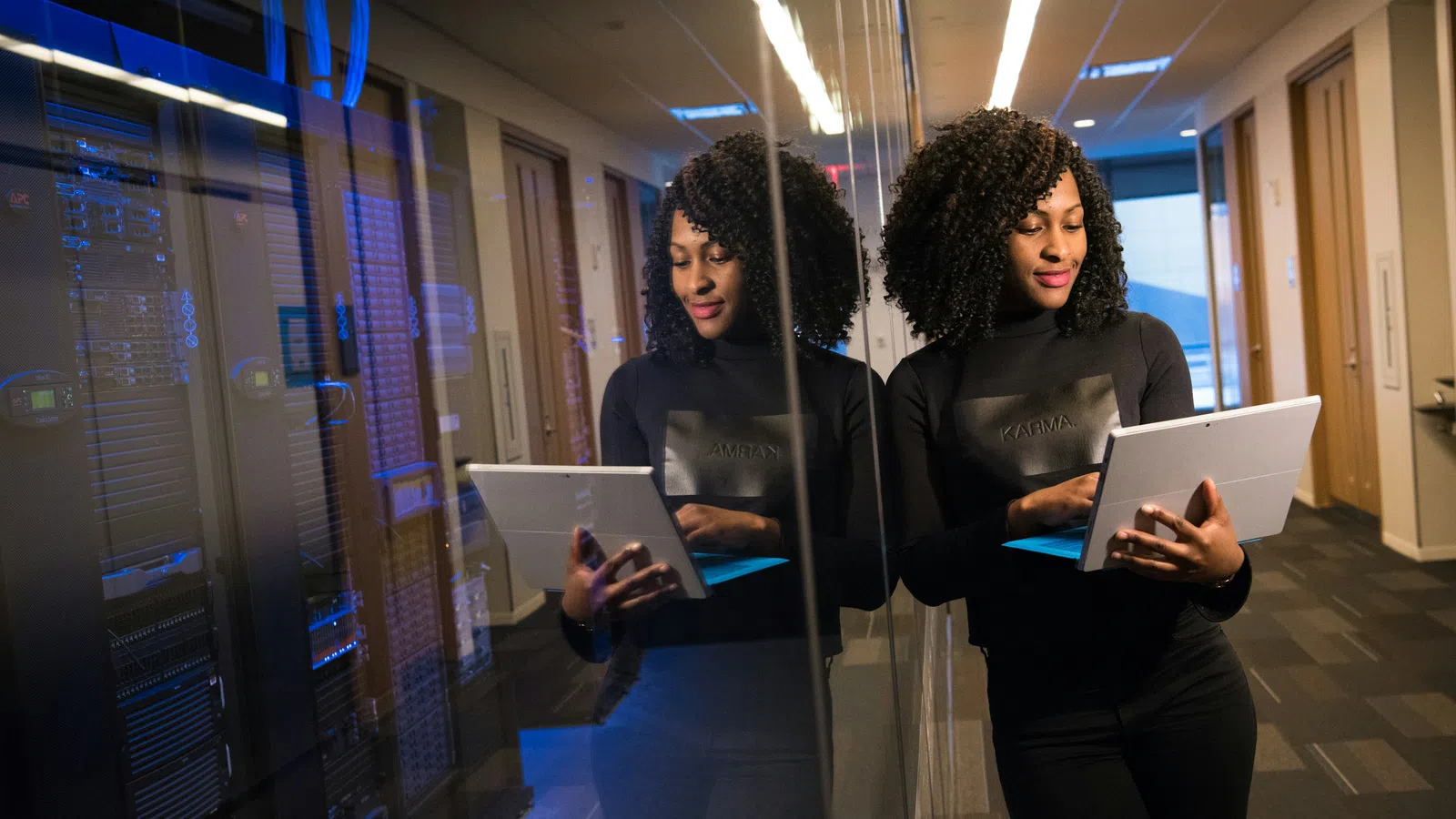 a woman looking at a tablet