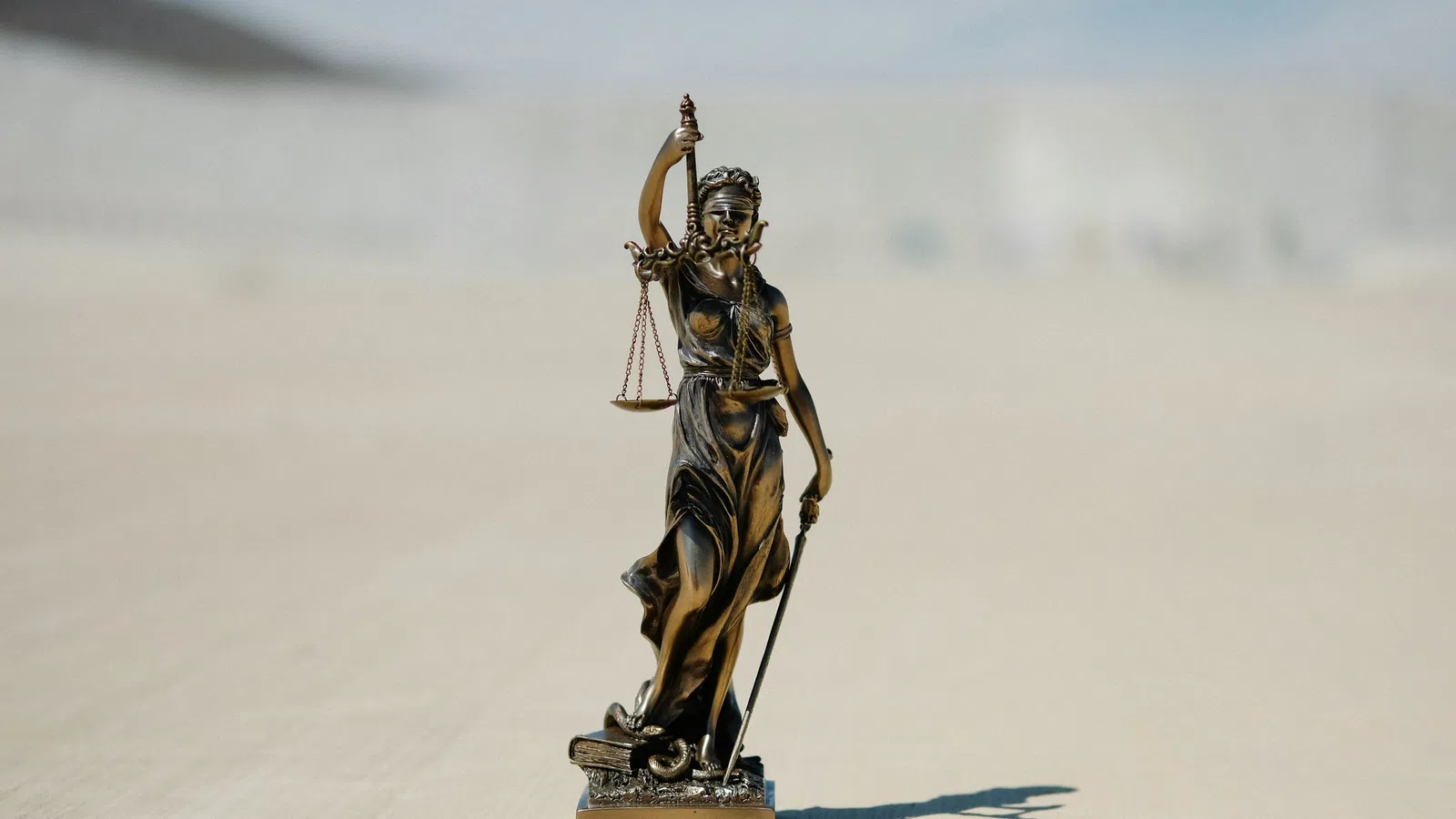 a statue of a person holding a sword