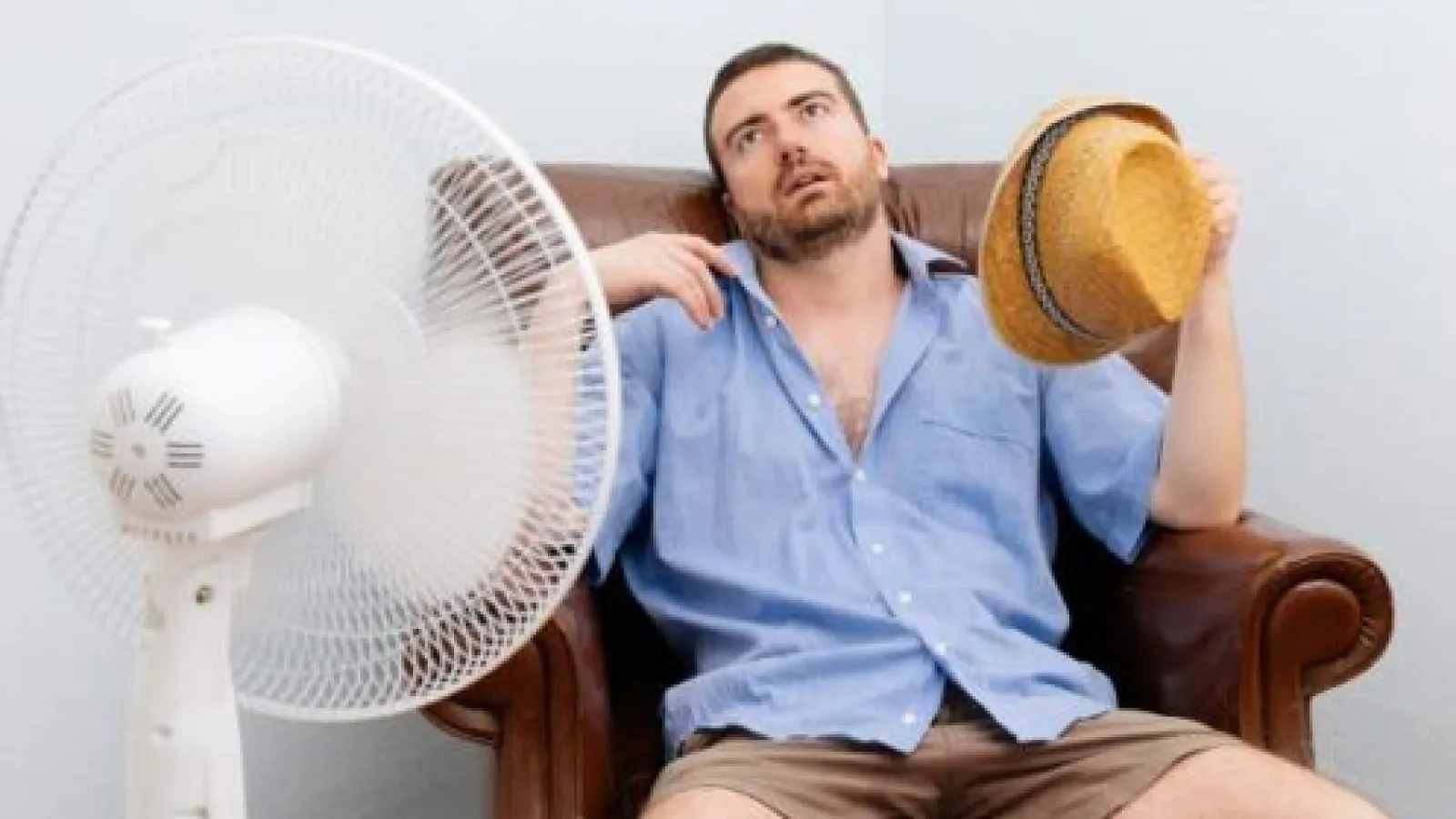 Man Sweating Because He Has No Air Conditioner