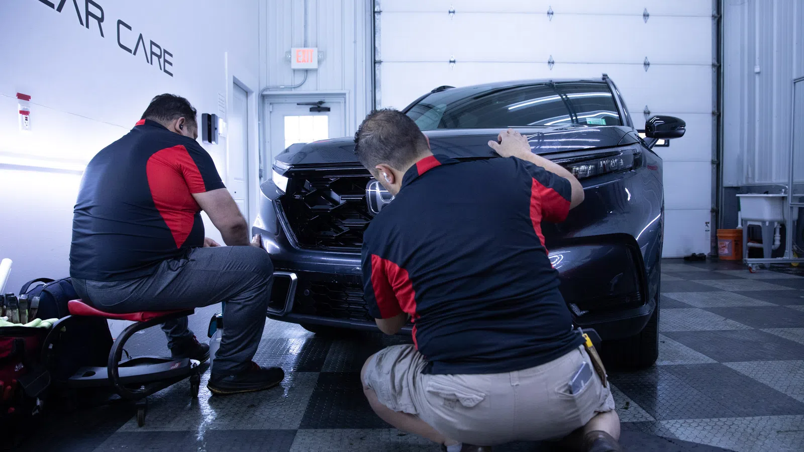 men working on a car