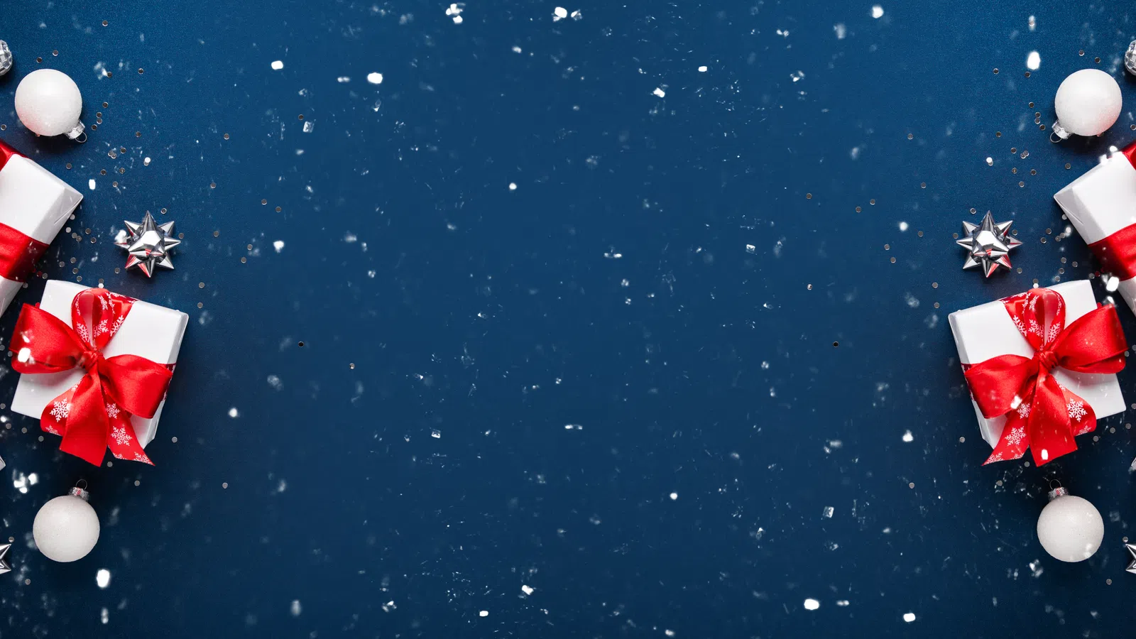 a group of red and white christmas ornaments on a blue background