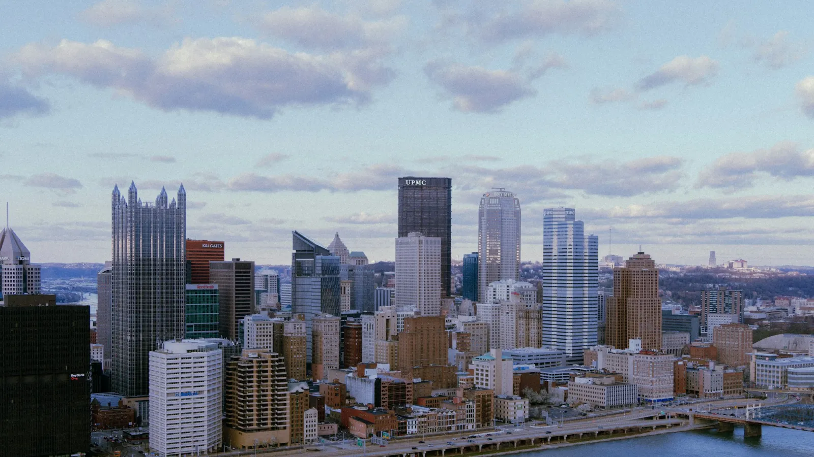 a city skyline with a river