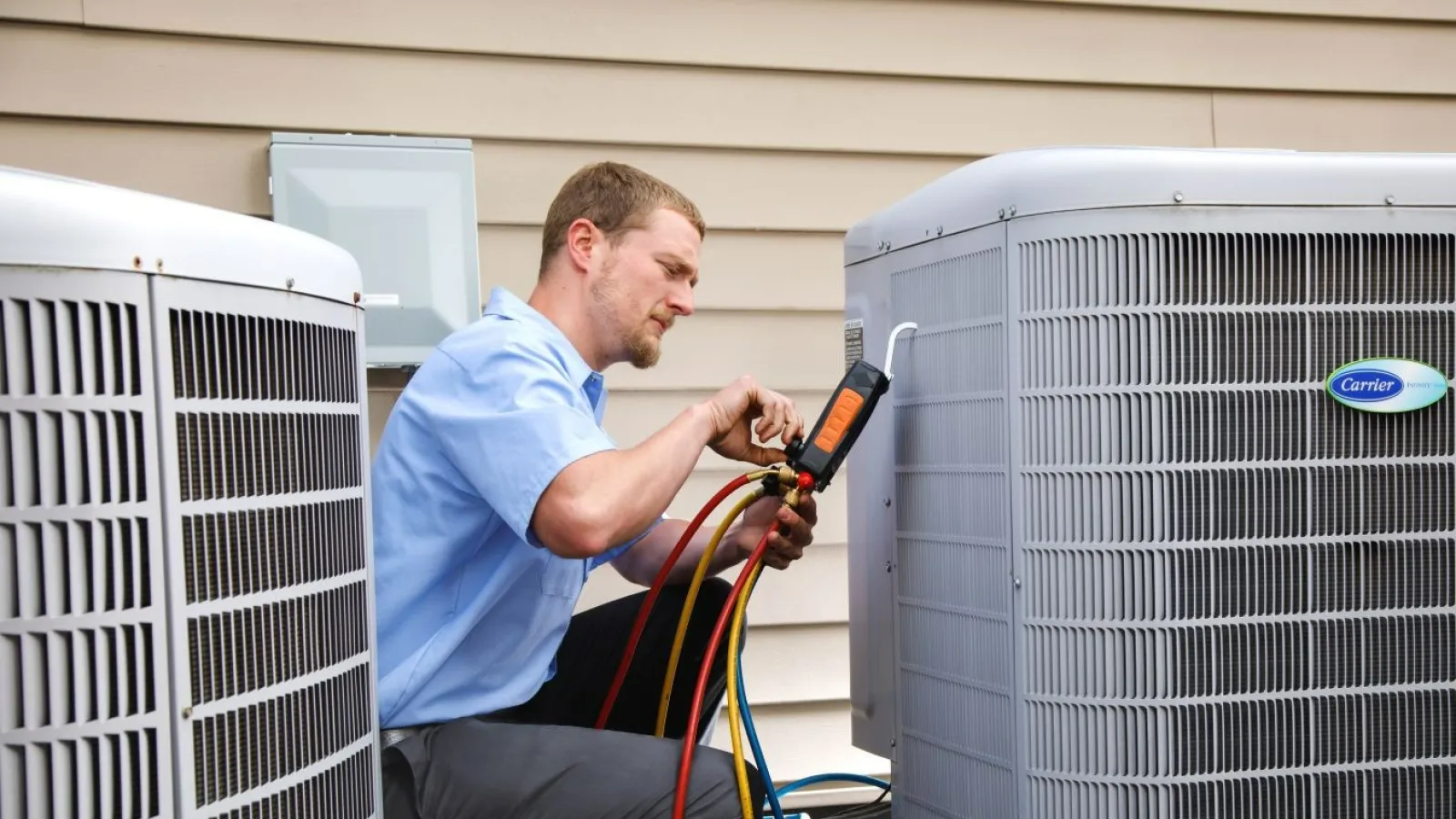 a man working on HVAC equipment in a Westmoreland County, PA outside