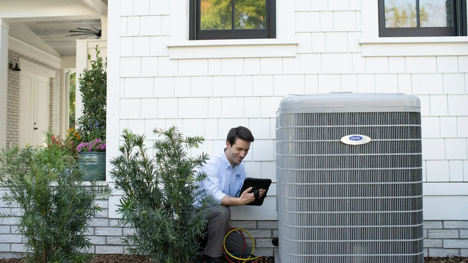 man outside looking at hvac AC