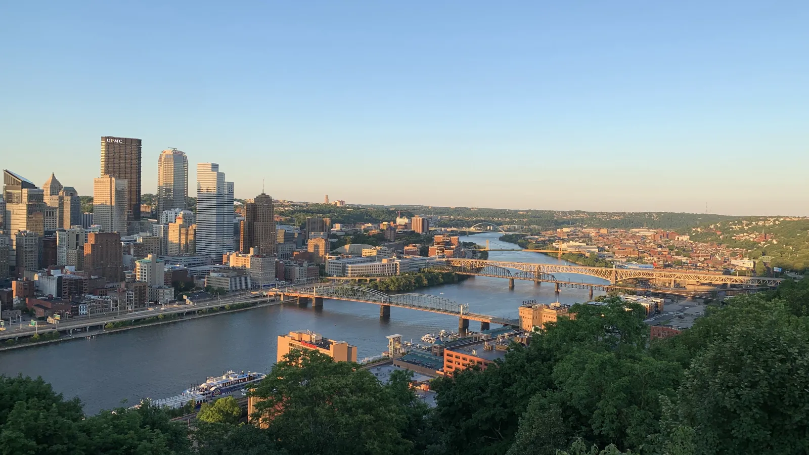 a river with a bridge and buildings by it