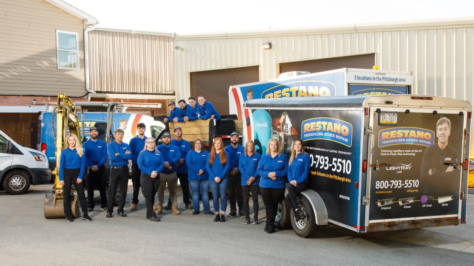 a group of people standing next to a truck