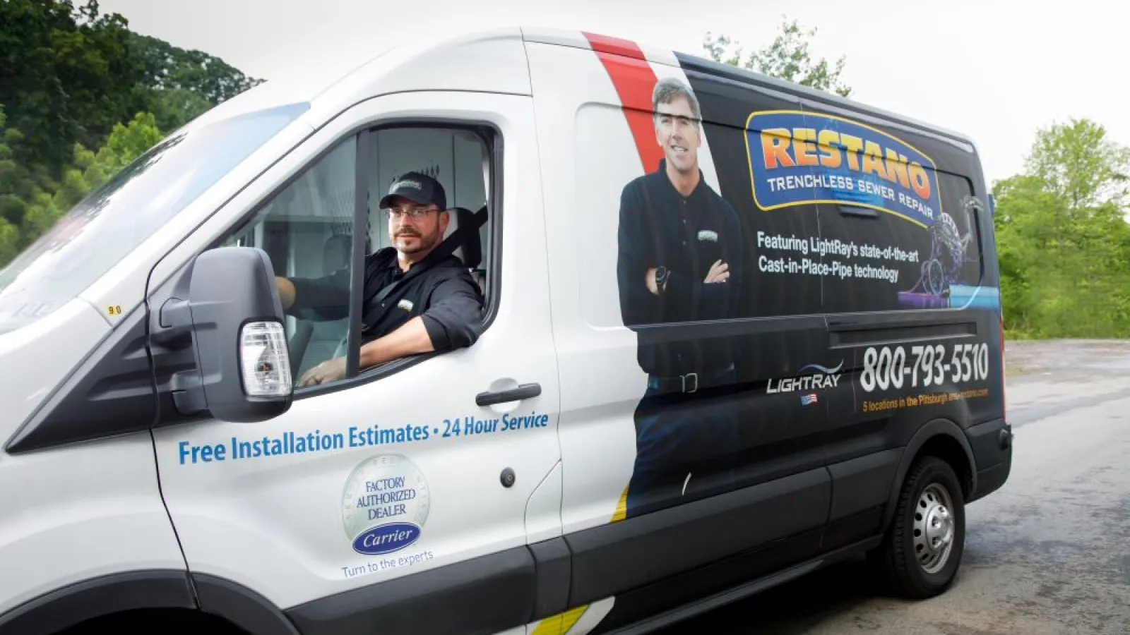 a couple of men in a white van with a black door