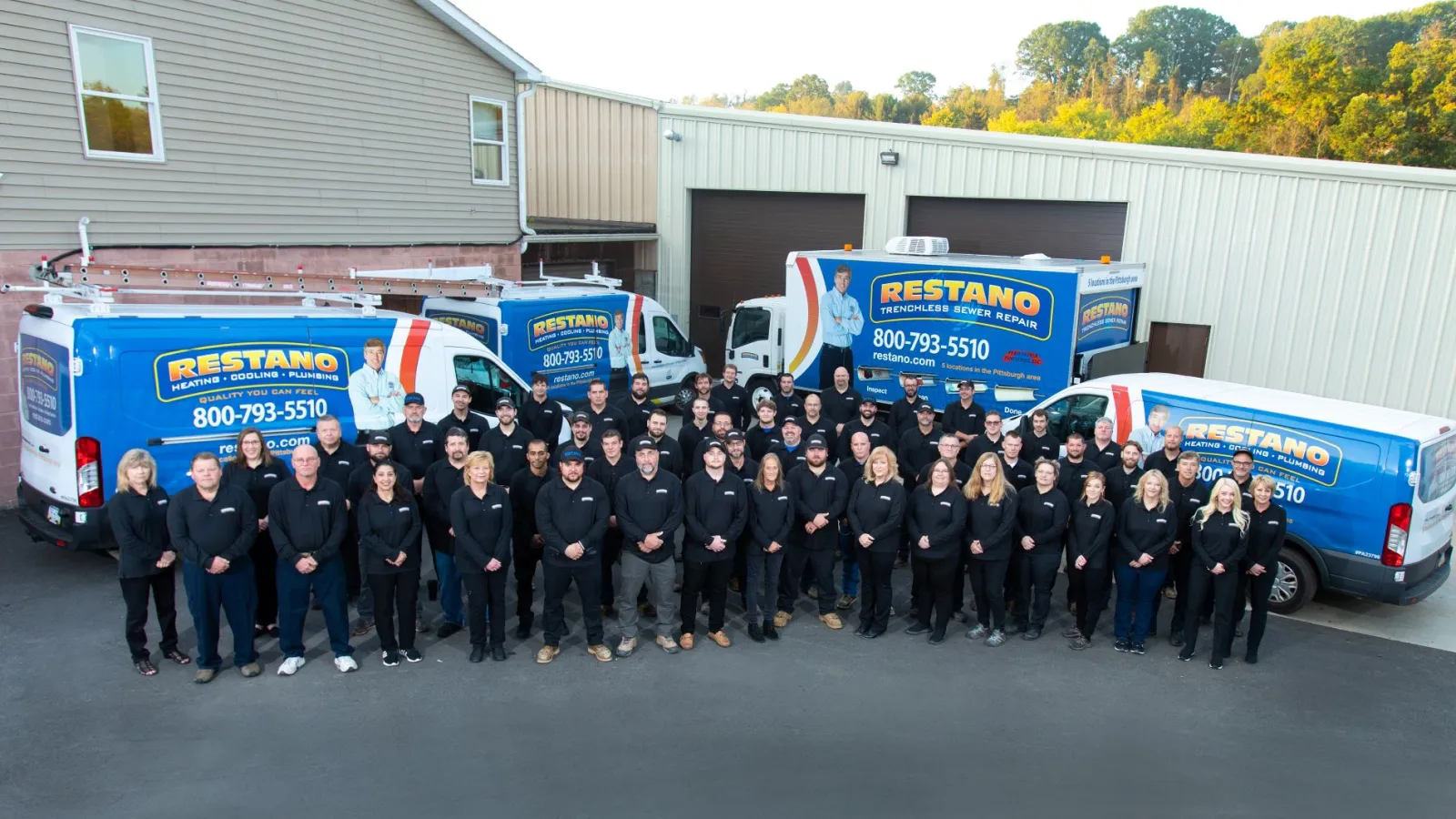 a group of people in black suits