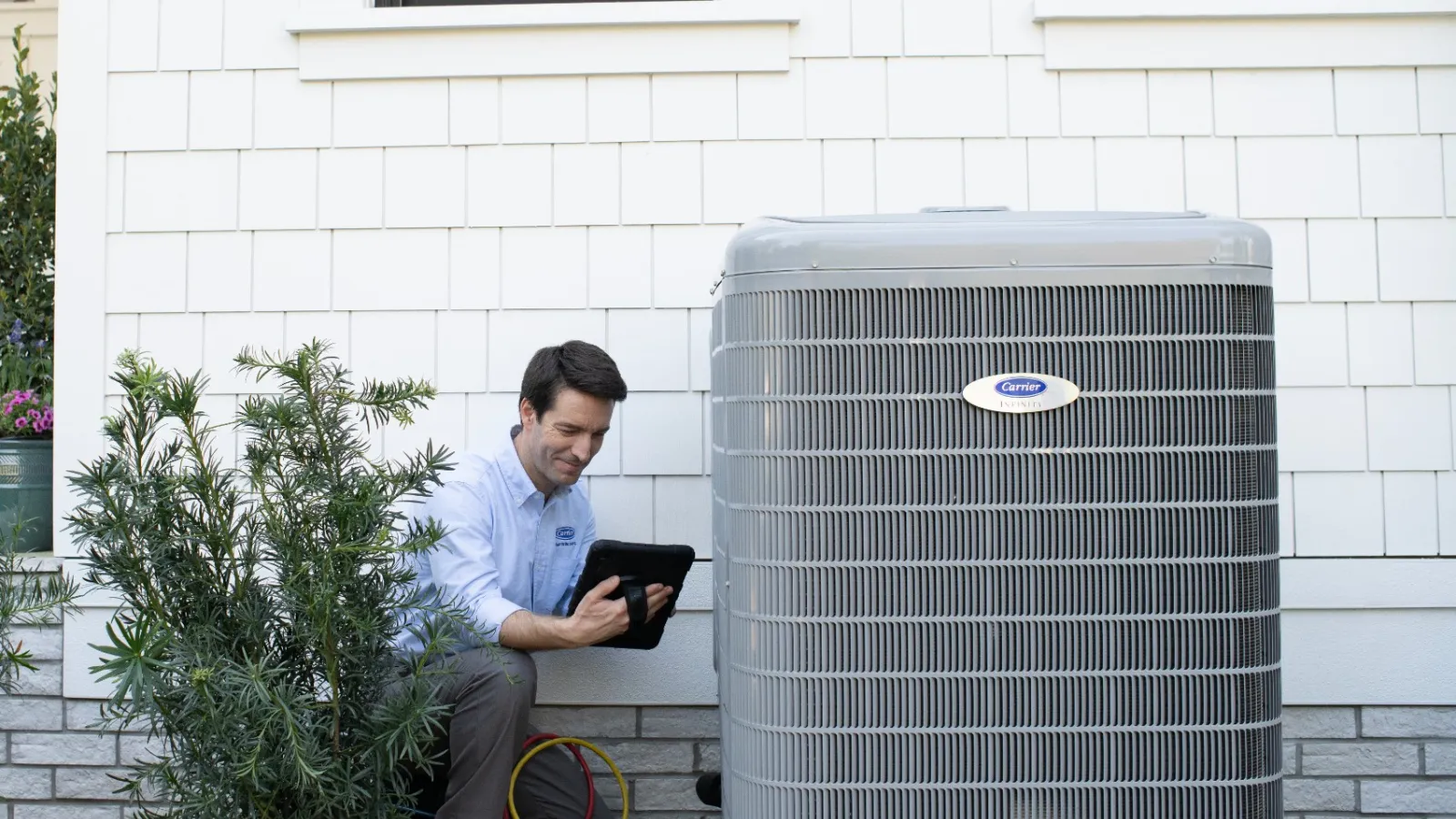 a man working on HVAC equipment in a Allegheny County, PA outside