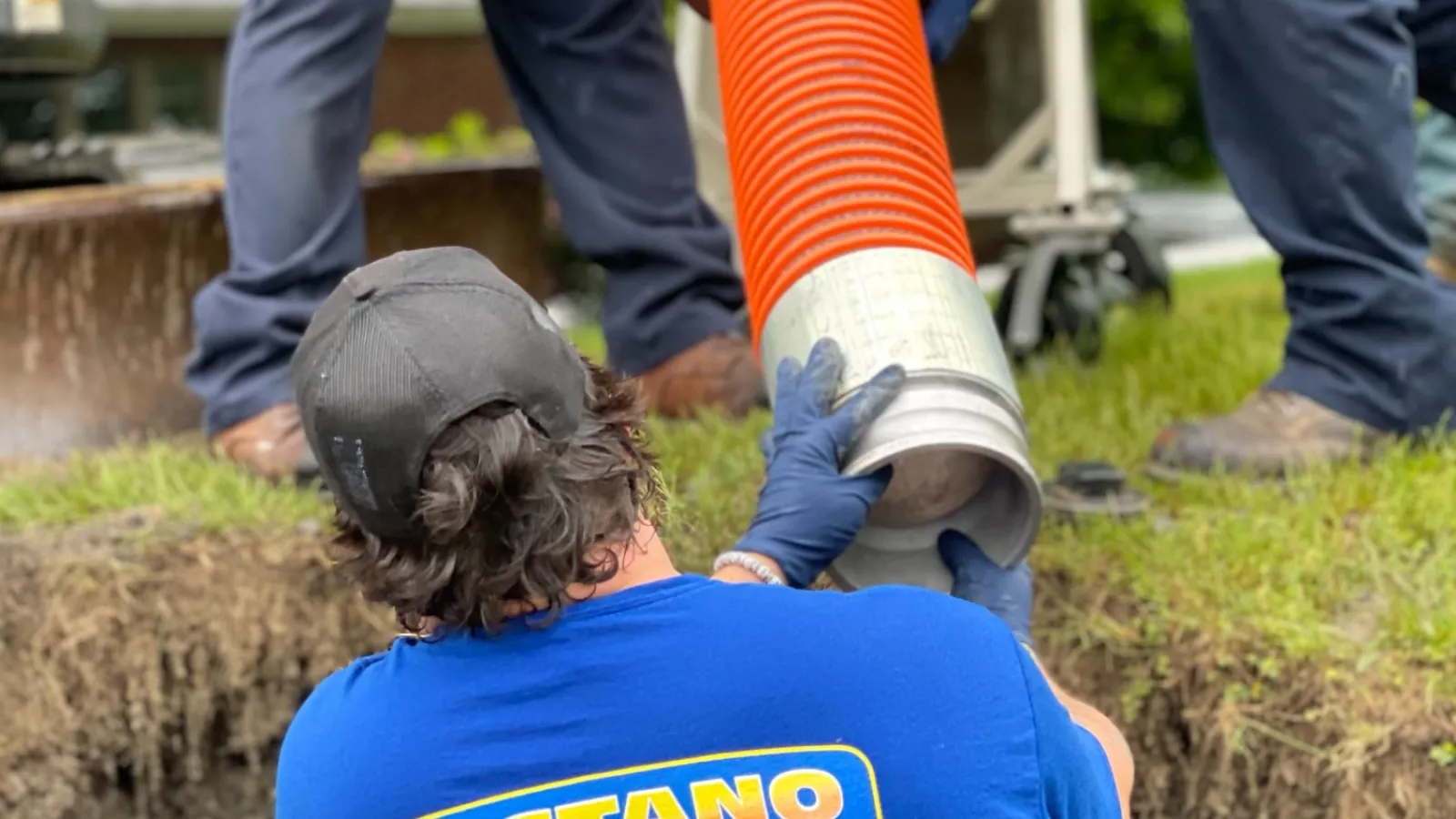 a group of people working on a sewer repair