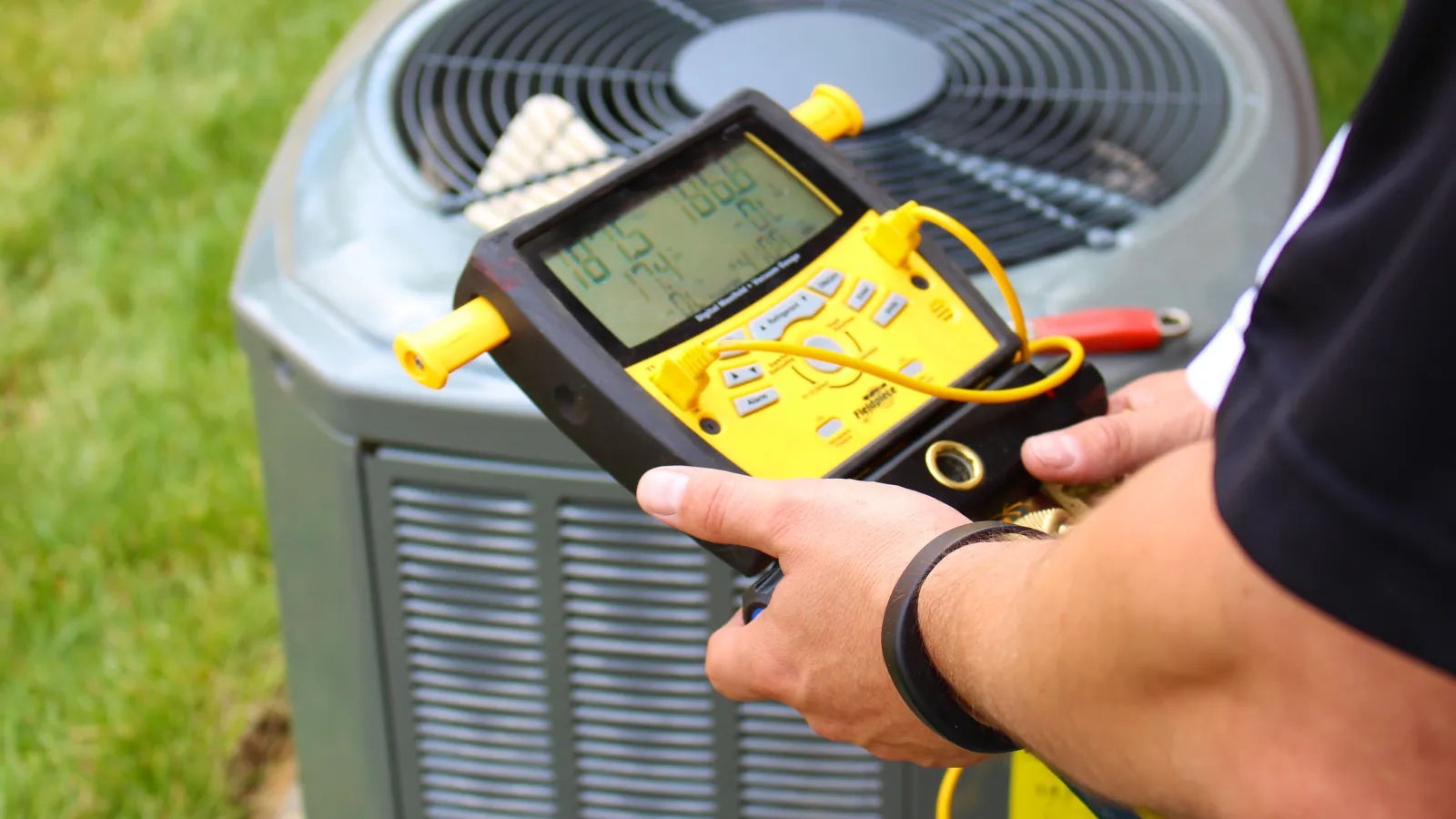 a person holding a yellow device