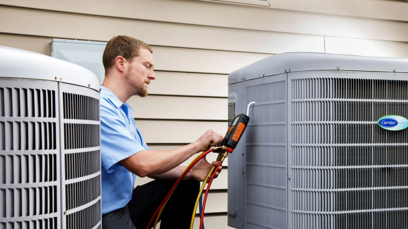 a man working on HVAC equipment in a Allegheny County, PA outside