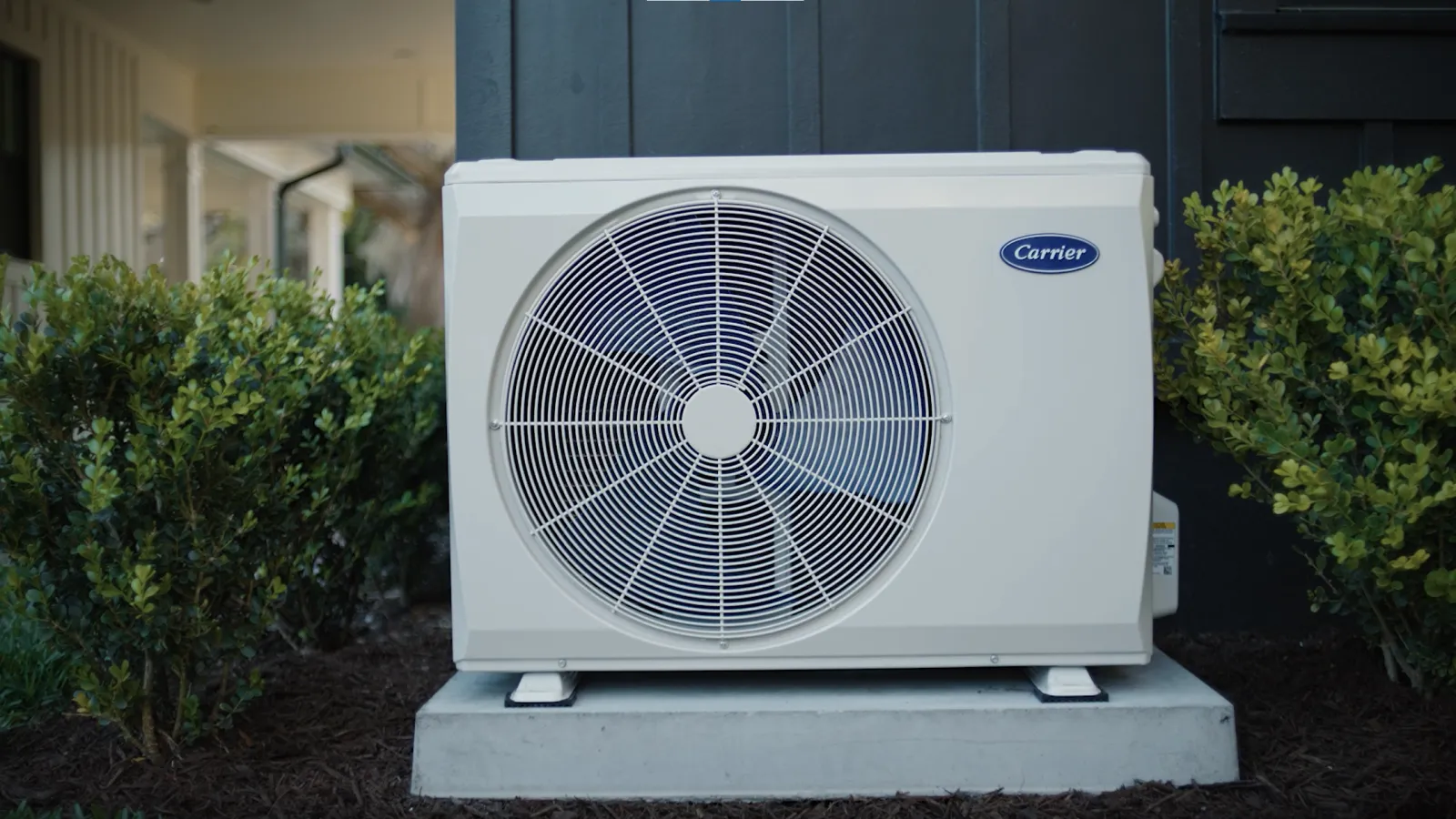 a white fan on a stand outside