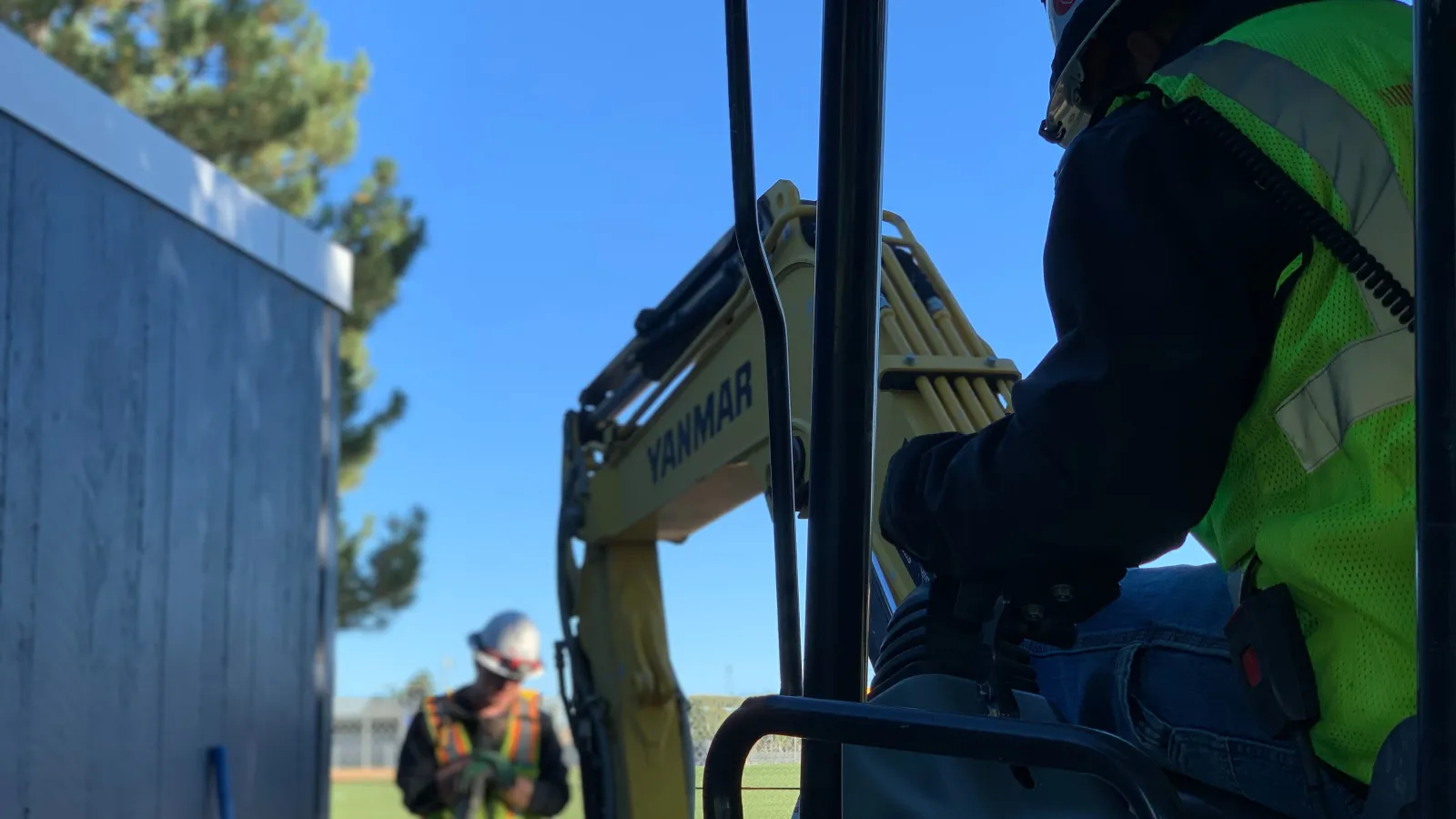 a firefighter standing next to a fire hydrant