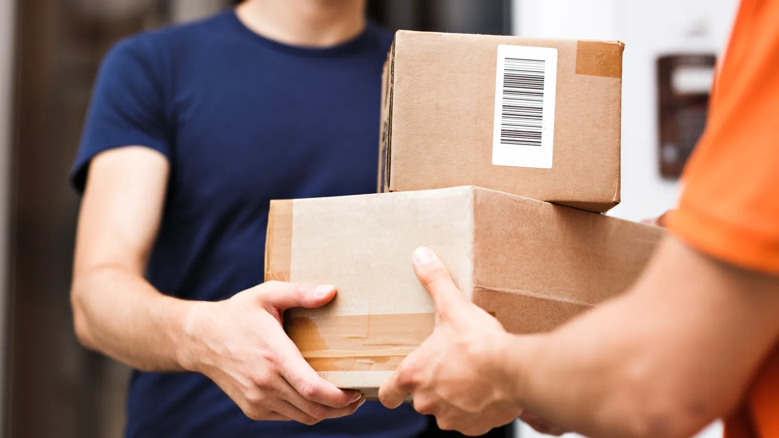 a few people holding boxes