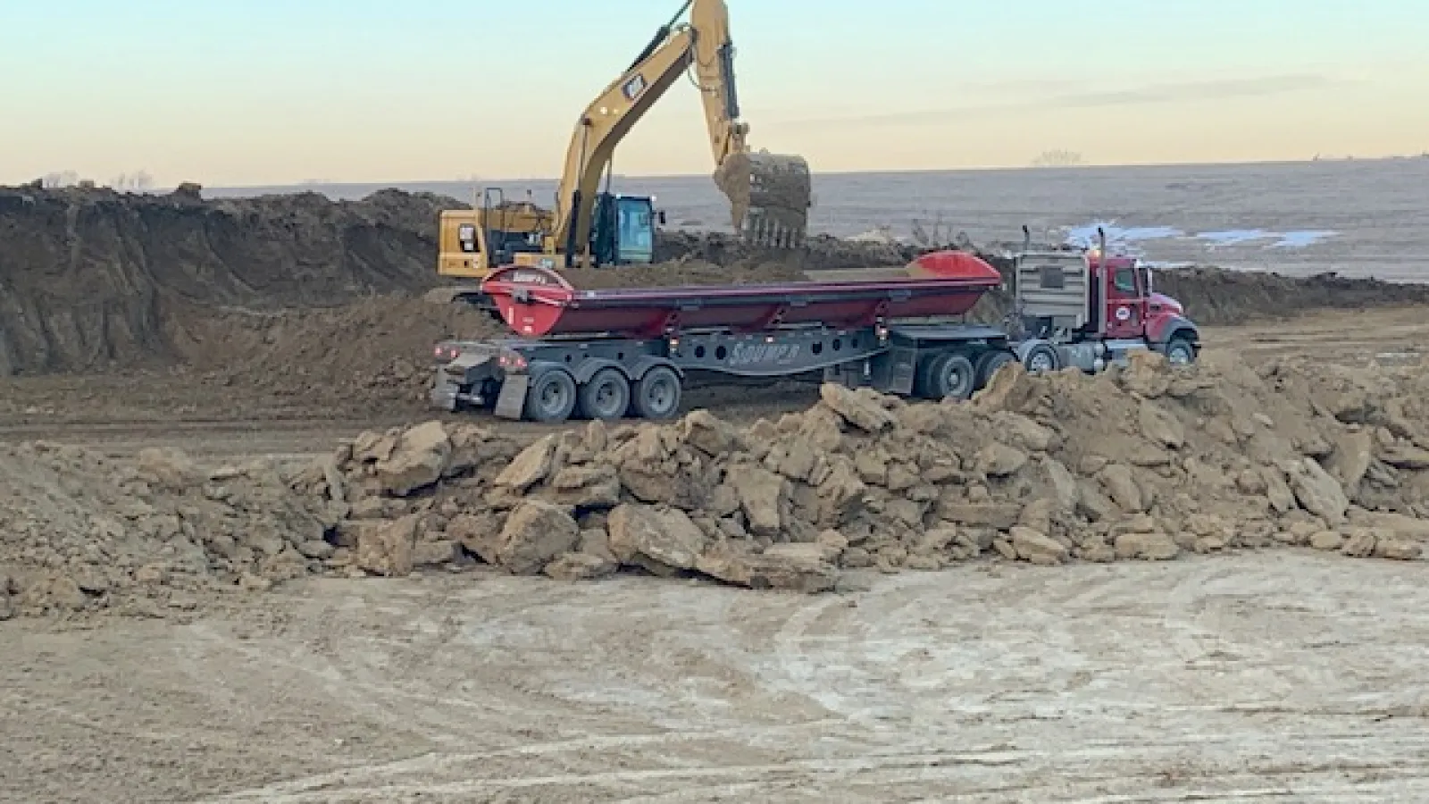 a truck on a rocky beach
