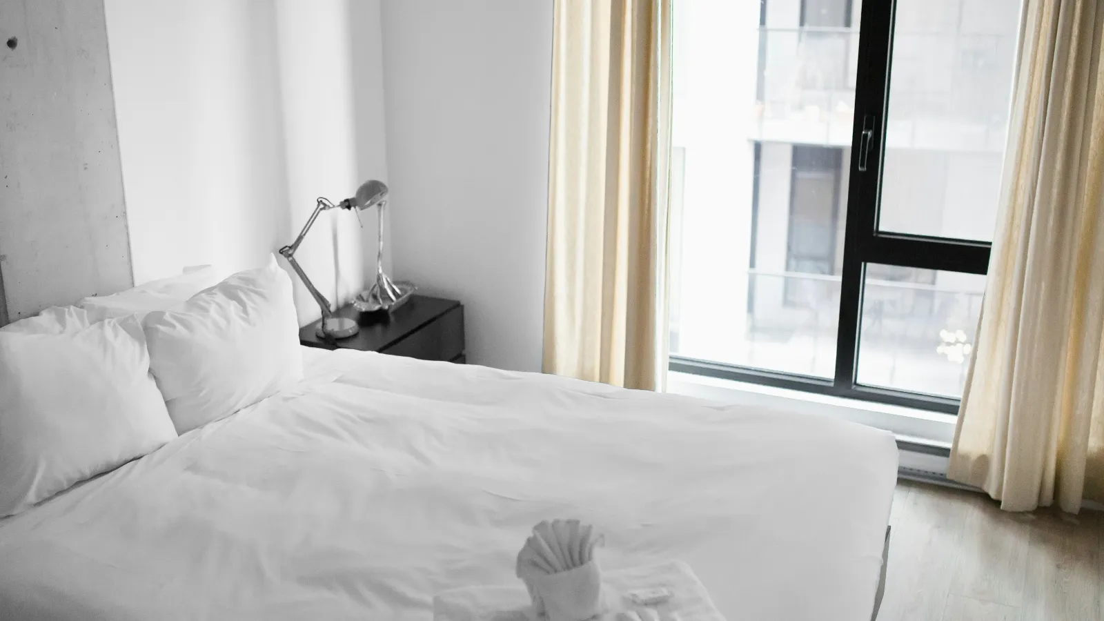a bed with white sheets