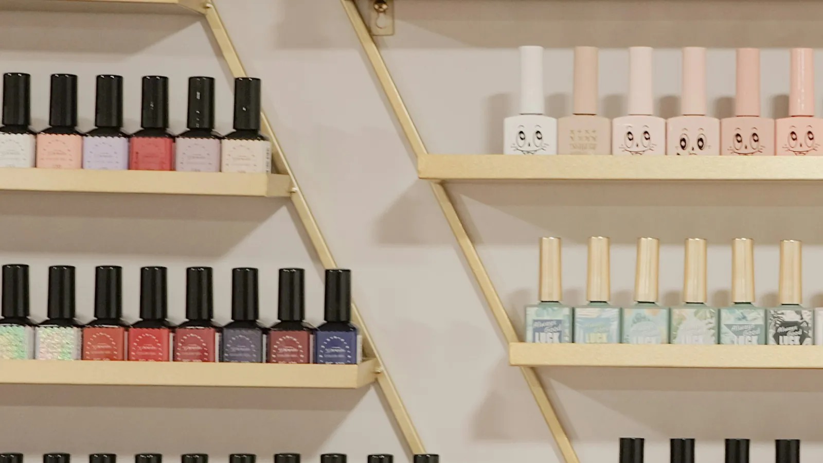 a shelf with many bottles of perfume