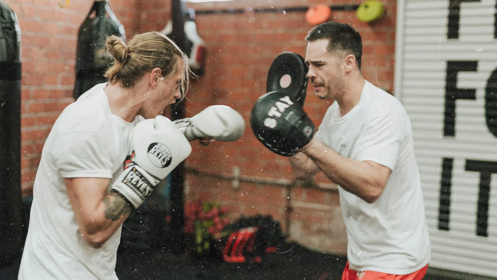 a man and a woman boxing