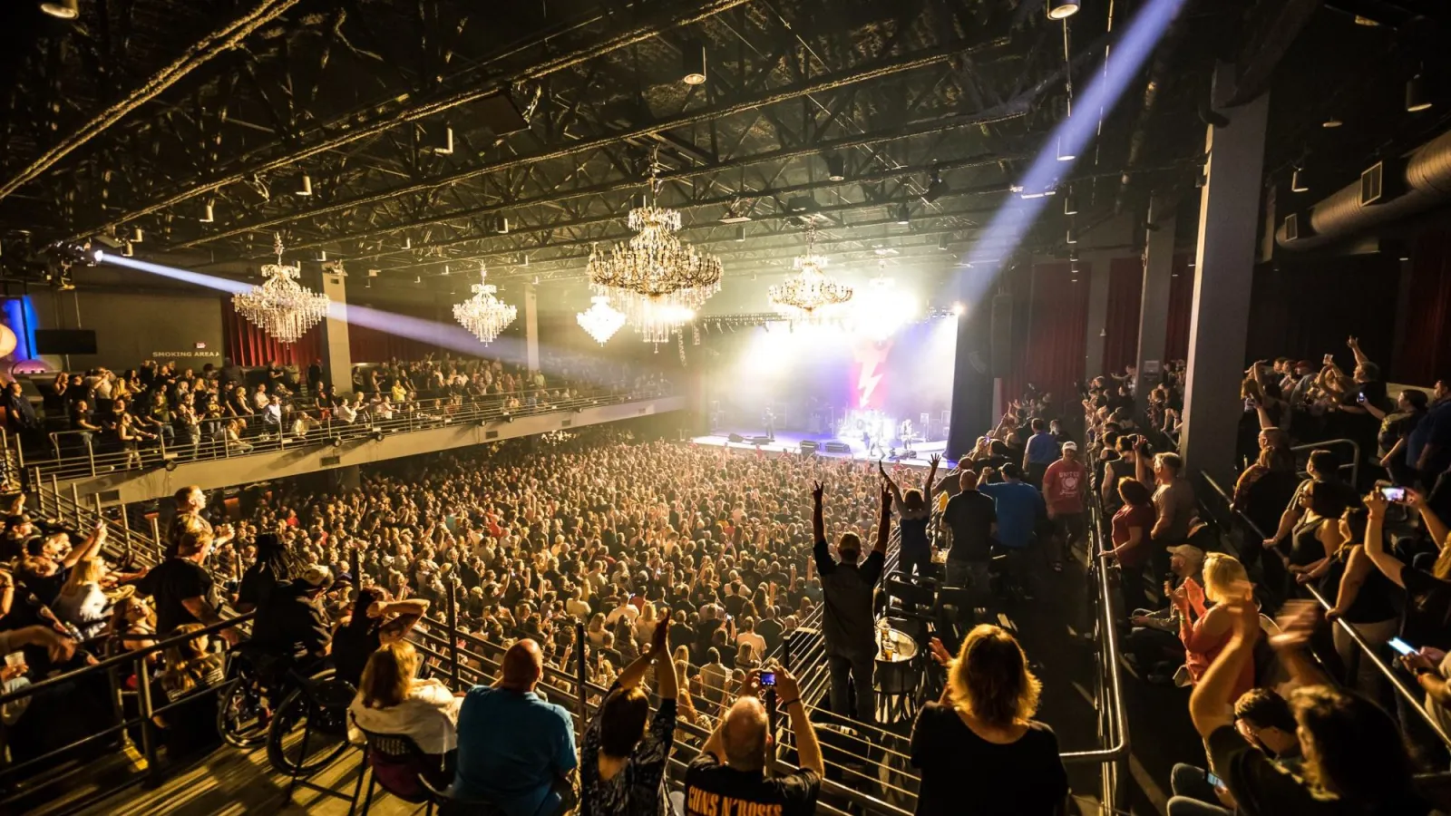 a large crowd of people in a concert hall