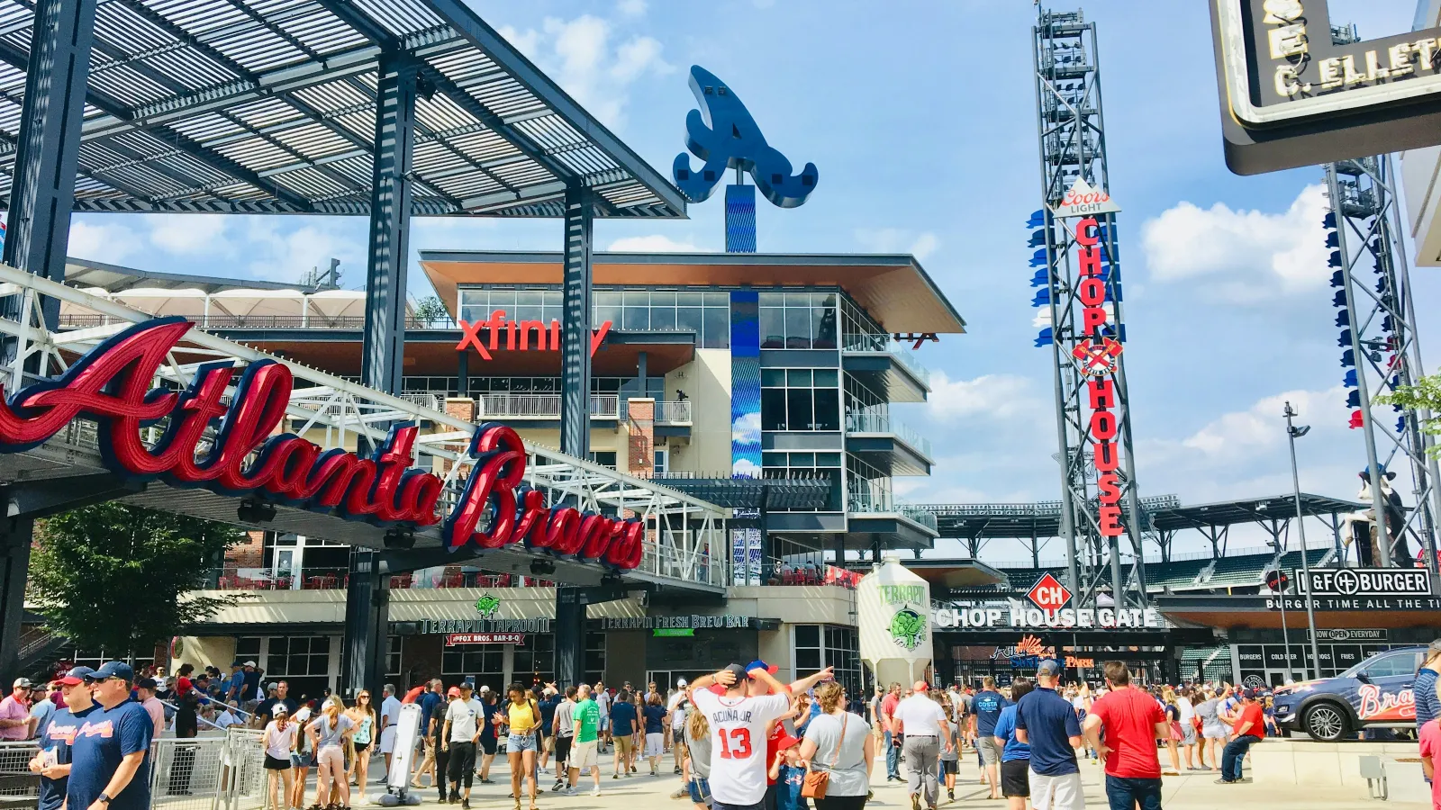 a crowd of people outside of a stadium