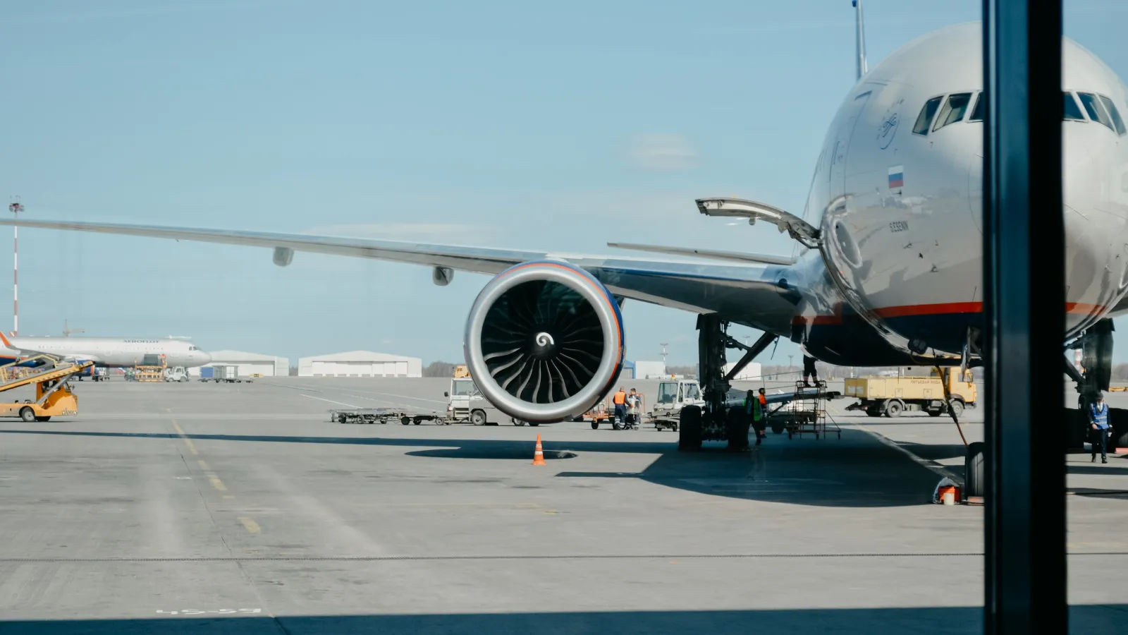 a large airplane is parked at an airport