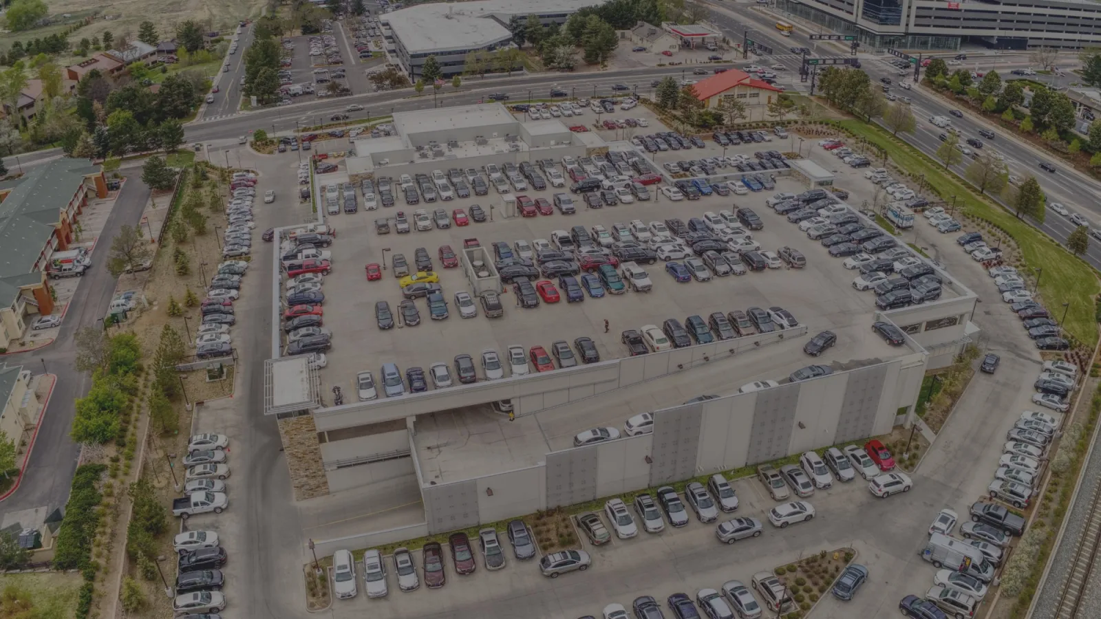 a large group of cars parked in a parking lot