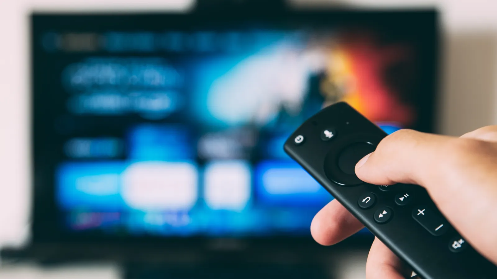 a person holding a remote control