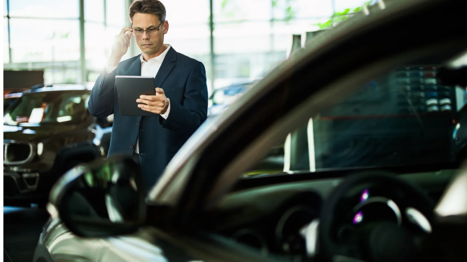 a person standing next to a car