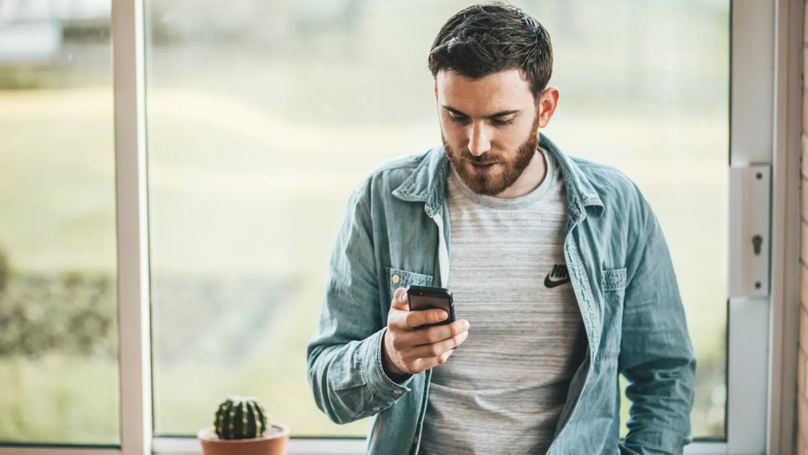 a man looking at his phone