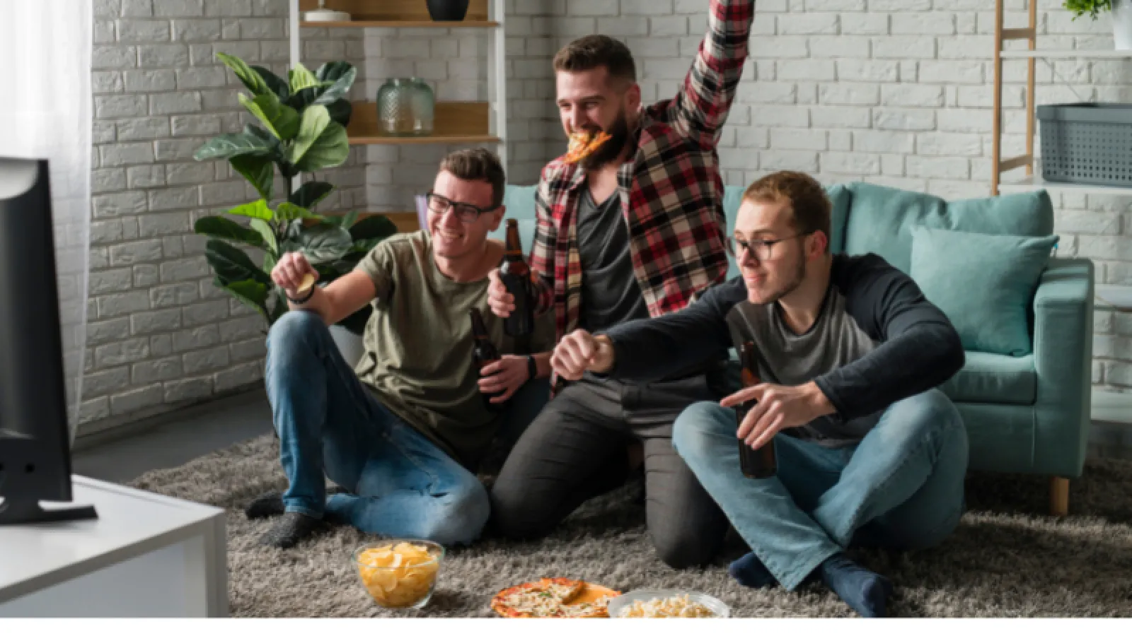 a group of men sitting on a couch
