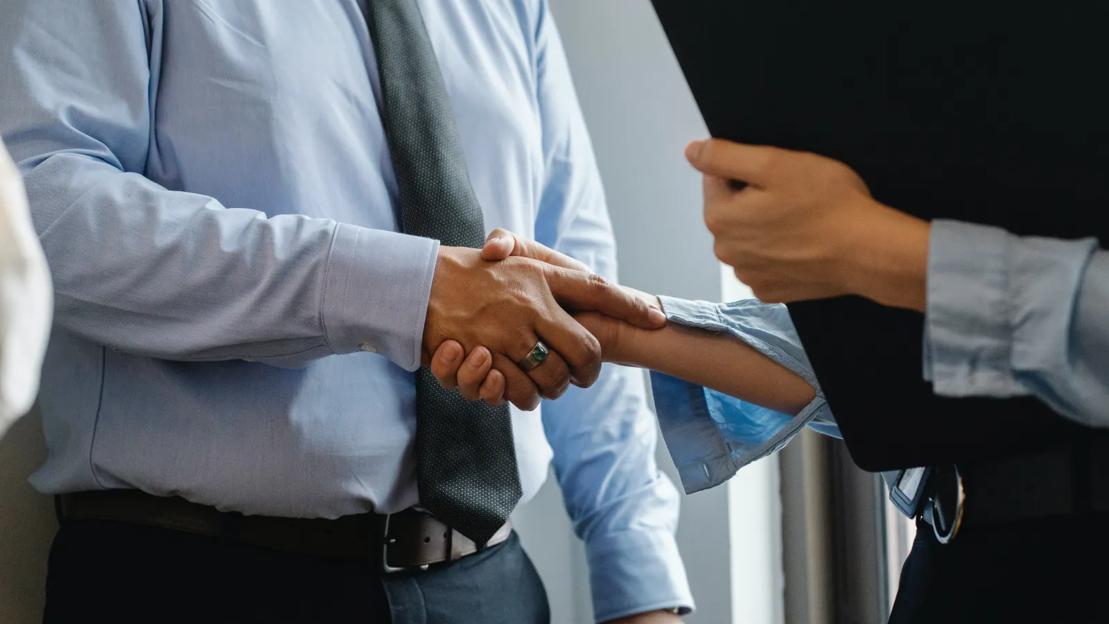 a man and a woman shaking hands