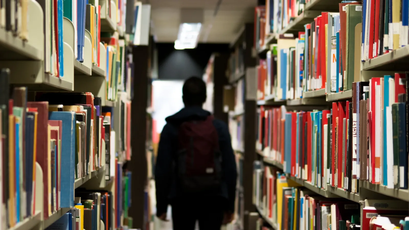 a person walking in a library