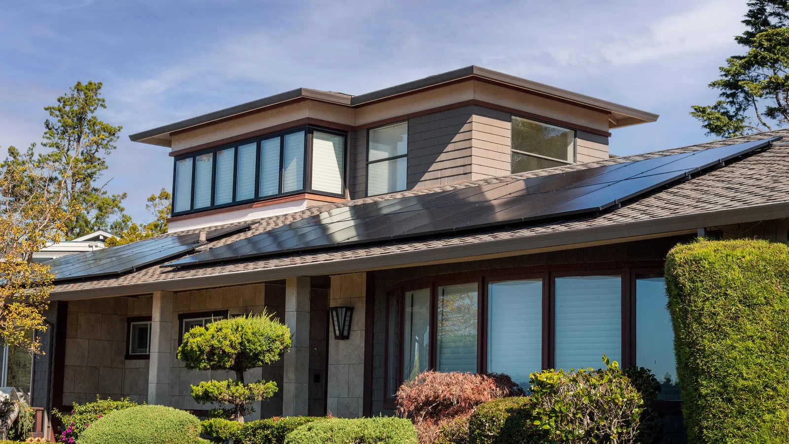 a residential home with solar photovoltaic system on the roof
