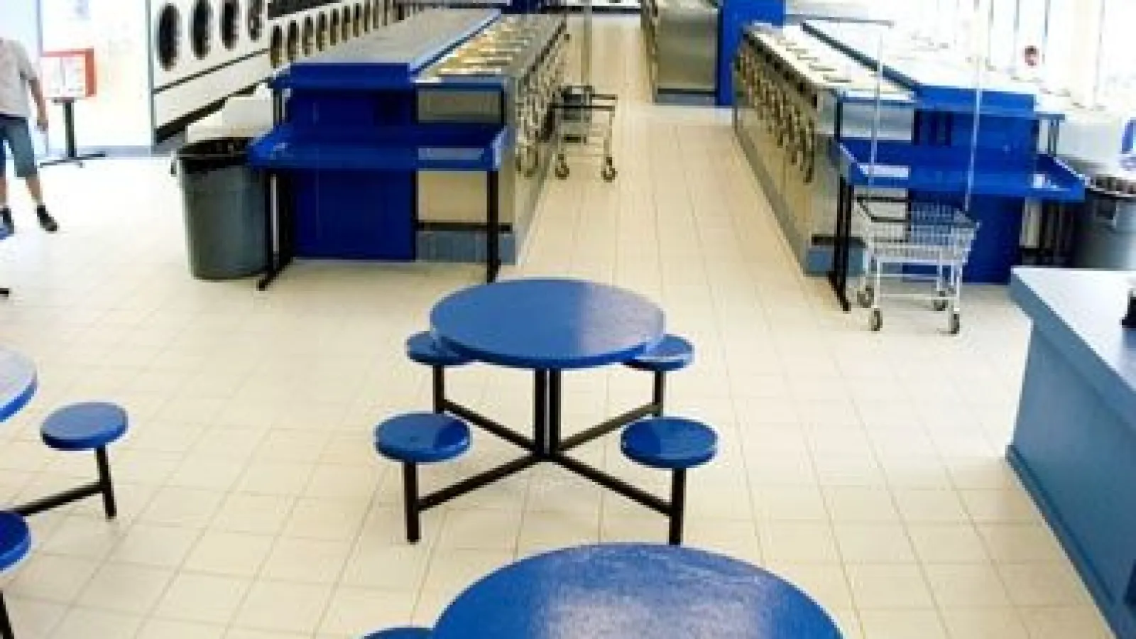 a table topped with a blue chair
