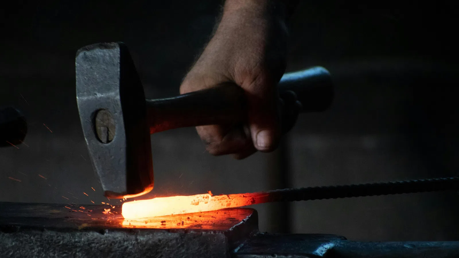 a person putting a fire in a furnace
