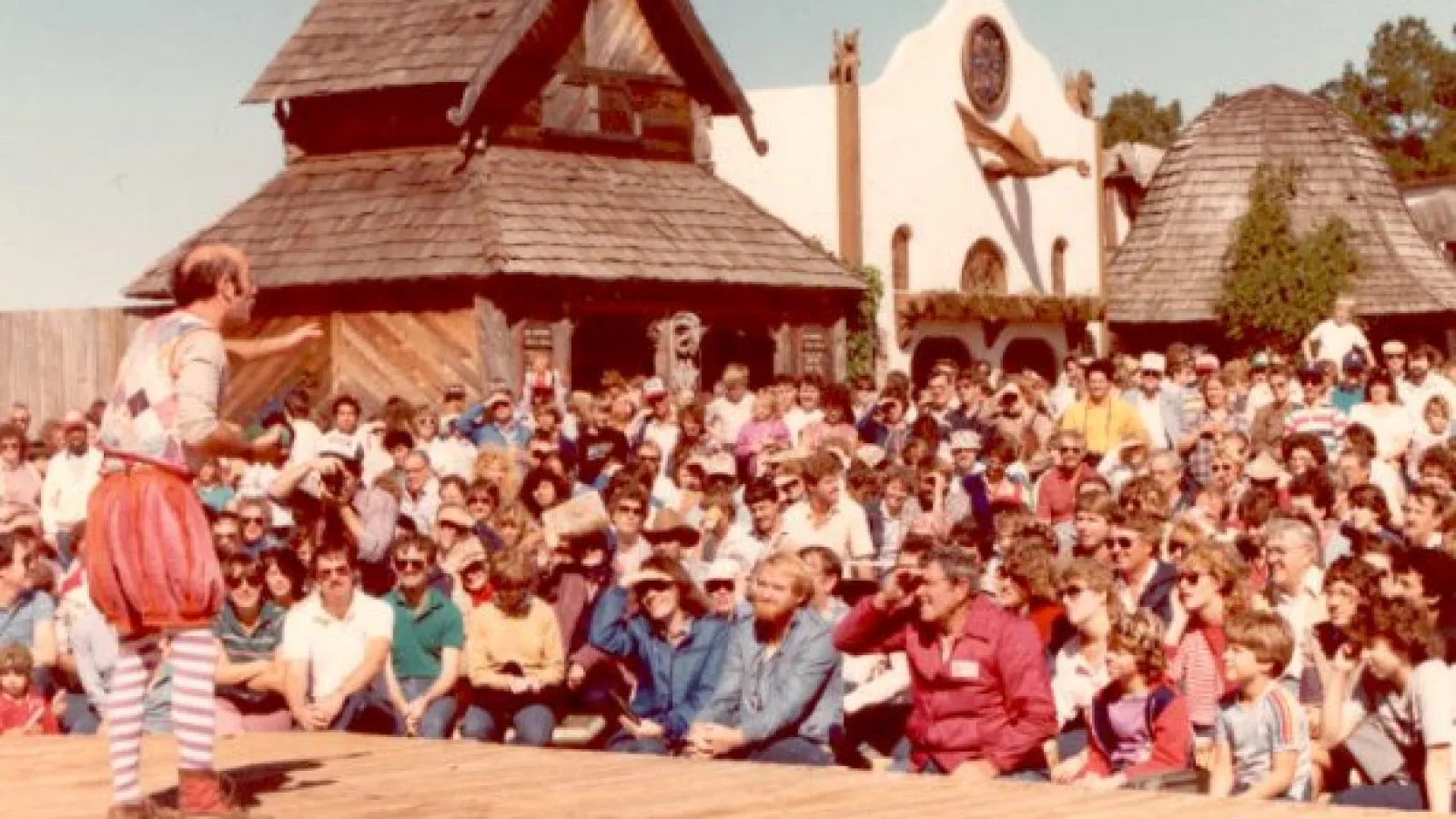 a group of people standing in front of a crowd