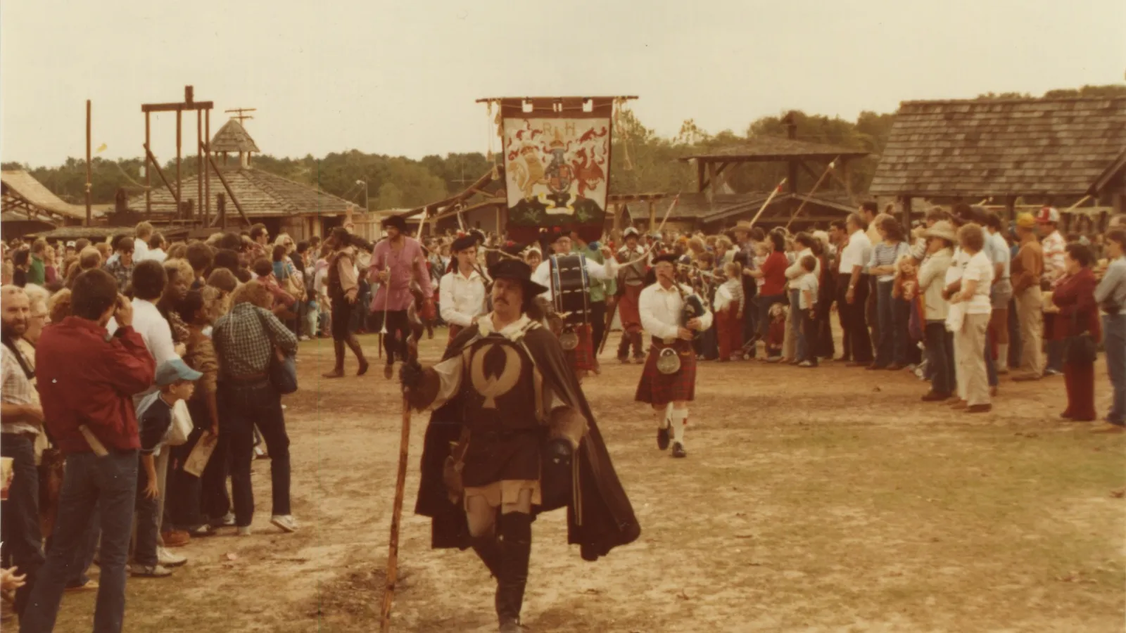 a group of people standing in front of a crowd