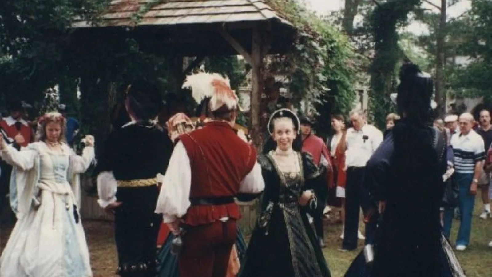 a group of people standing in front of a crowd
