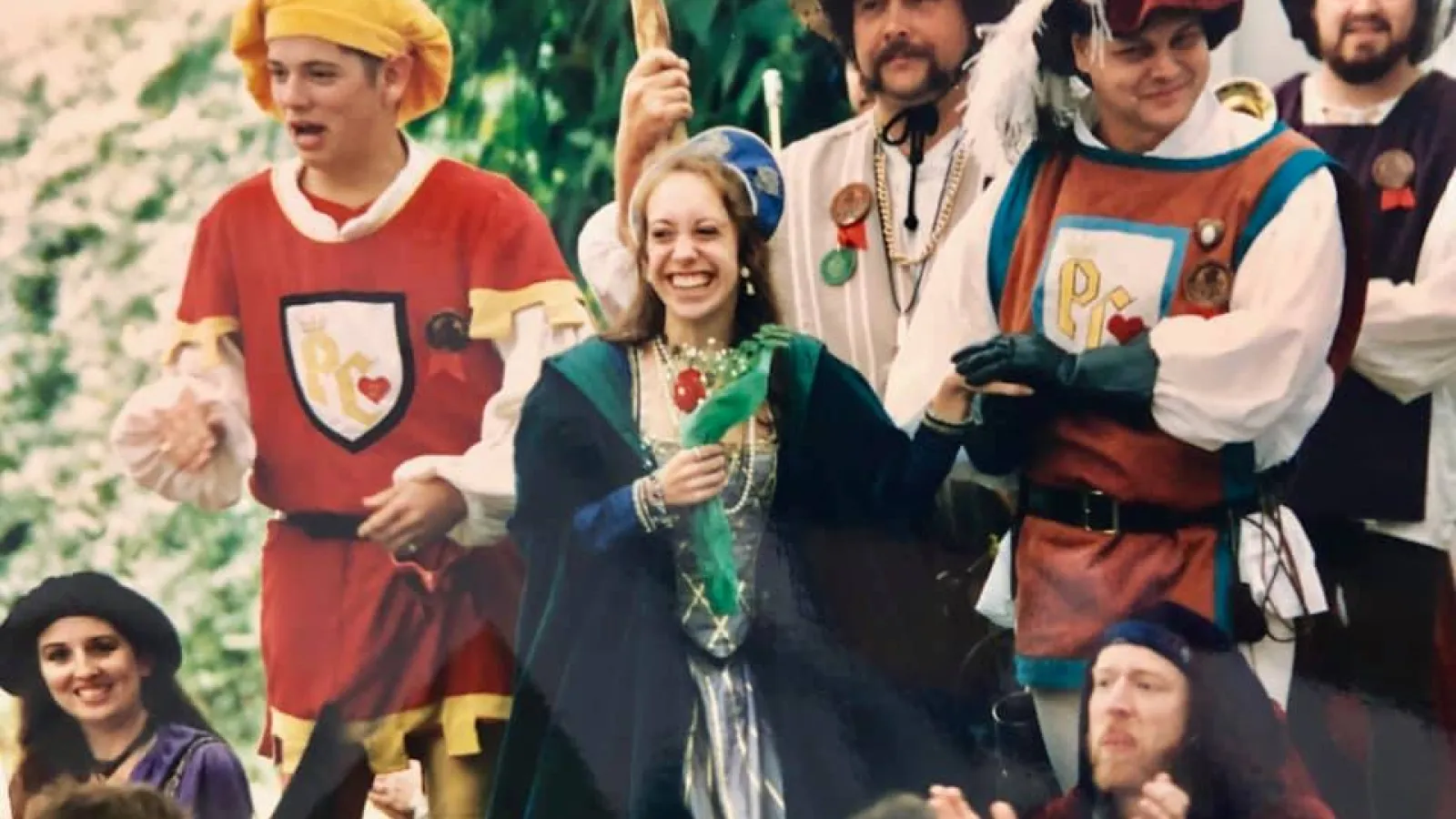 a group of people standing in front of a crowd