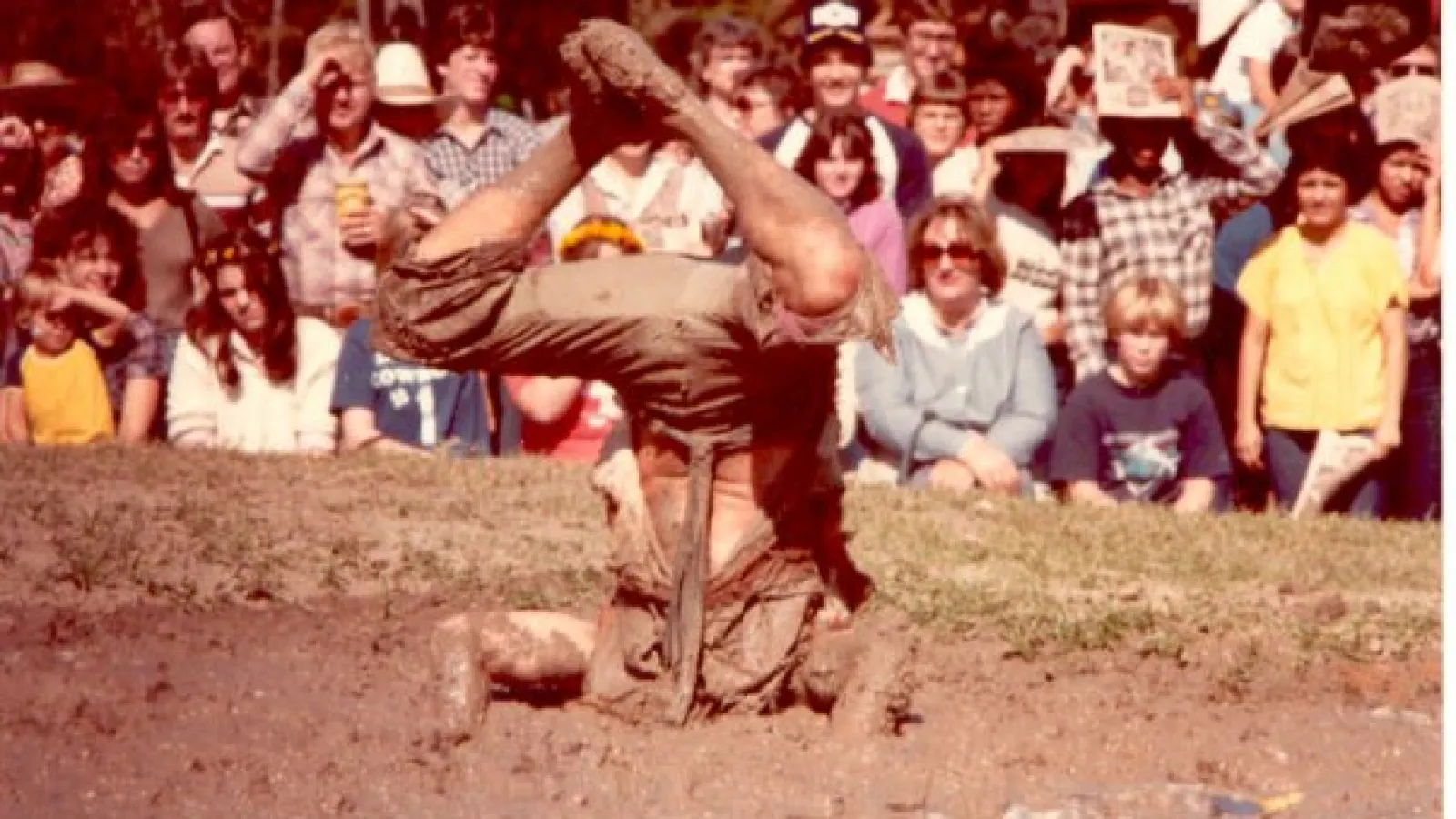 a group of people watching a baseball game
