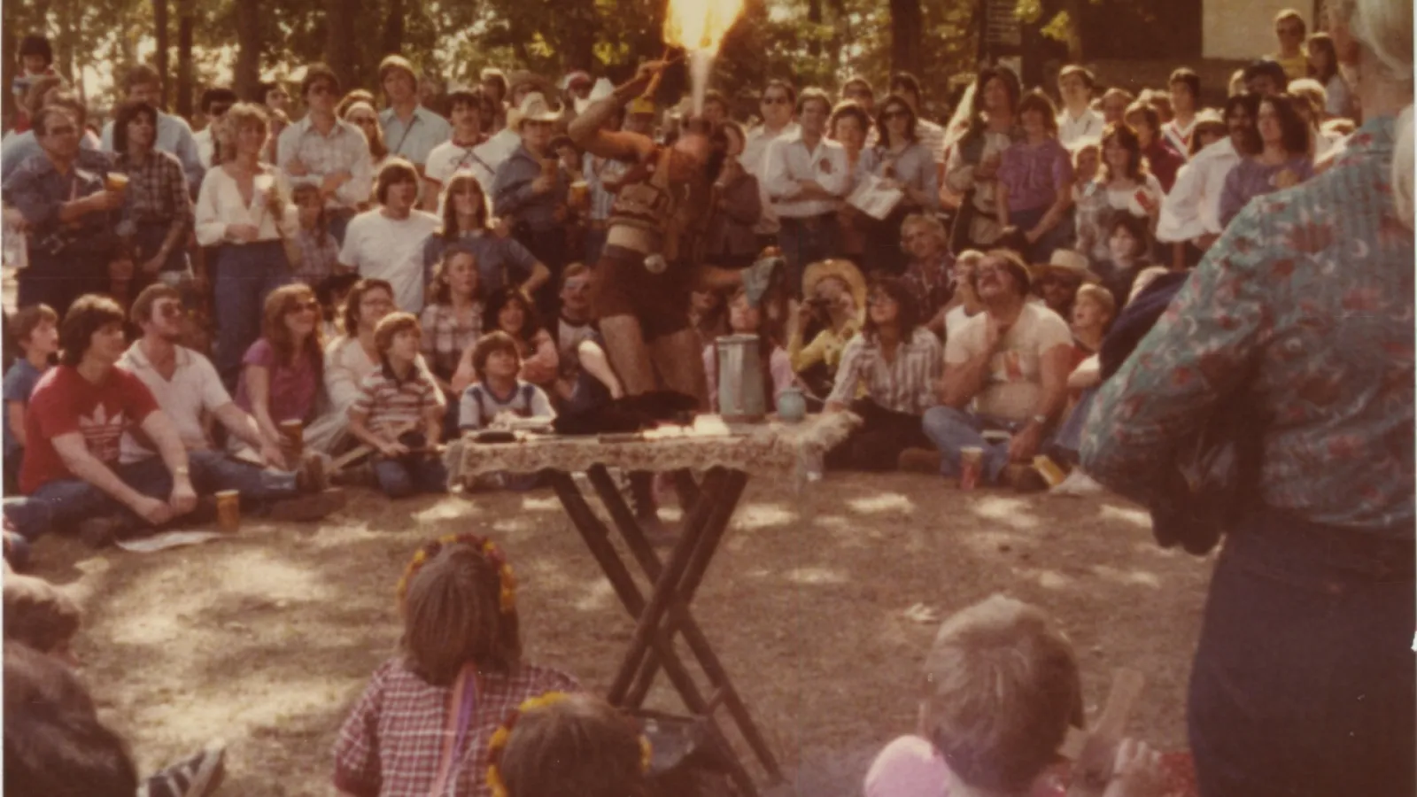 a group of people standing in front of a crowd