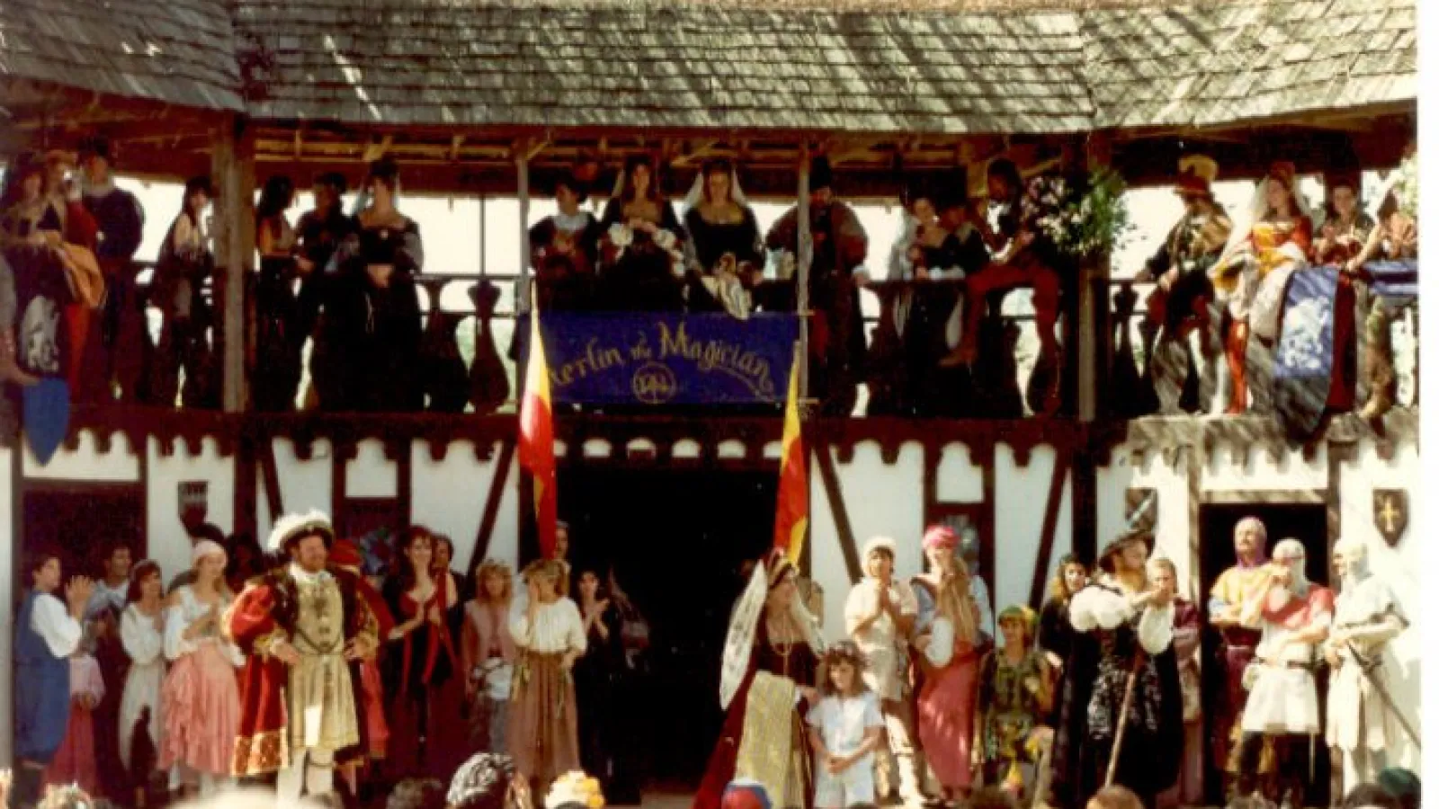 a group of people standing in front of a crowd