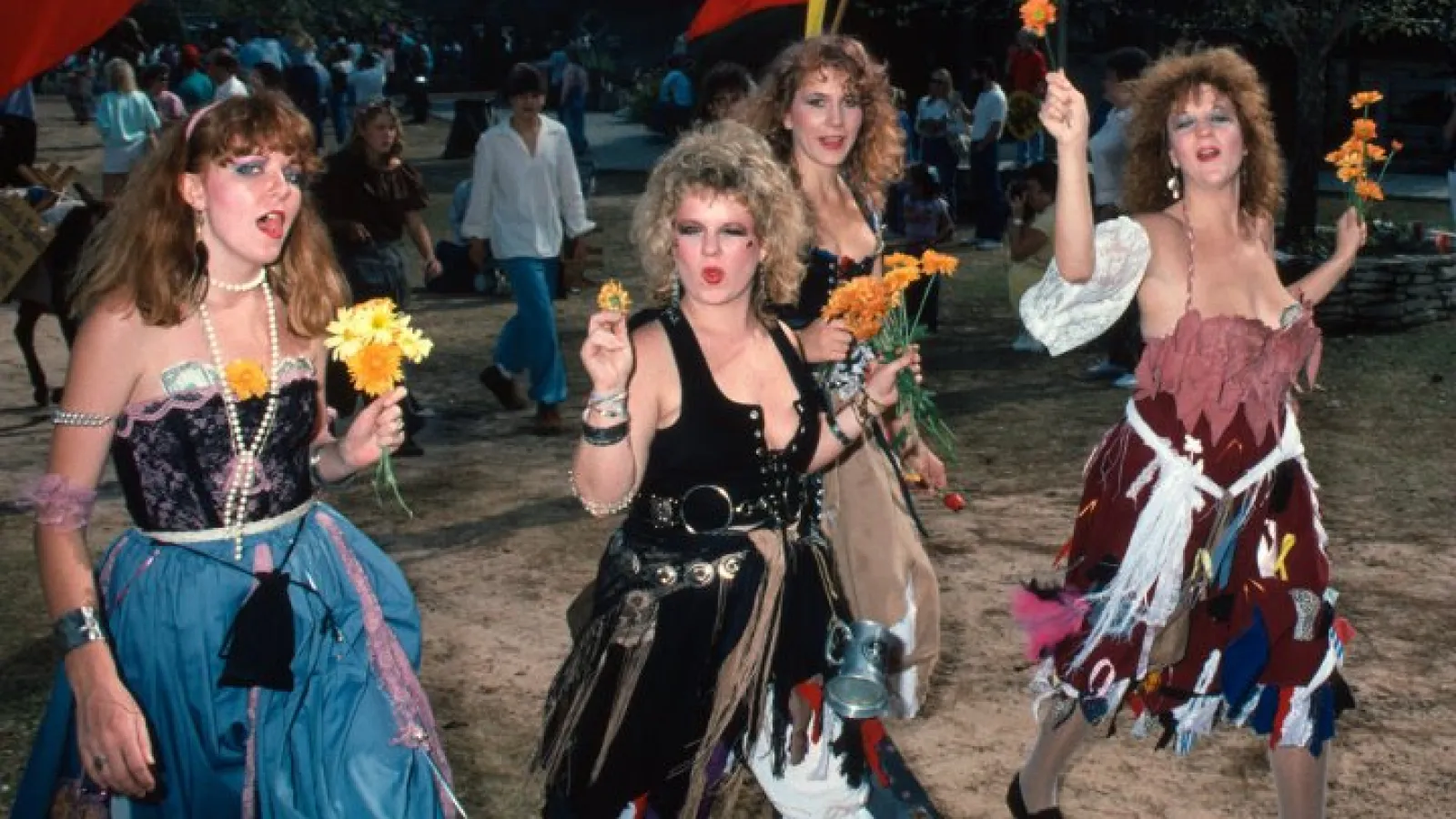 a group of people standing in front of a crowd