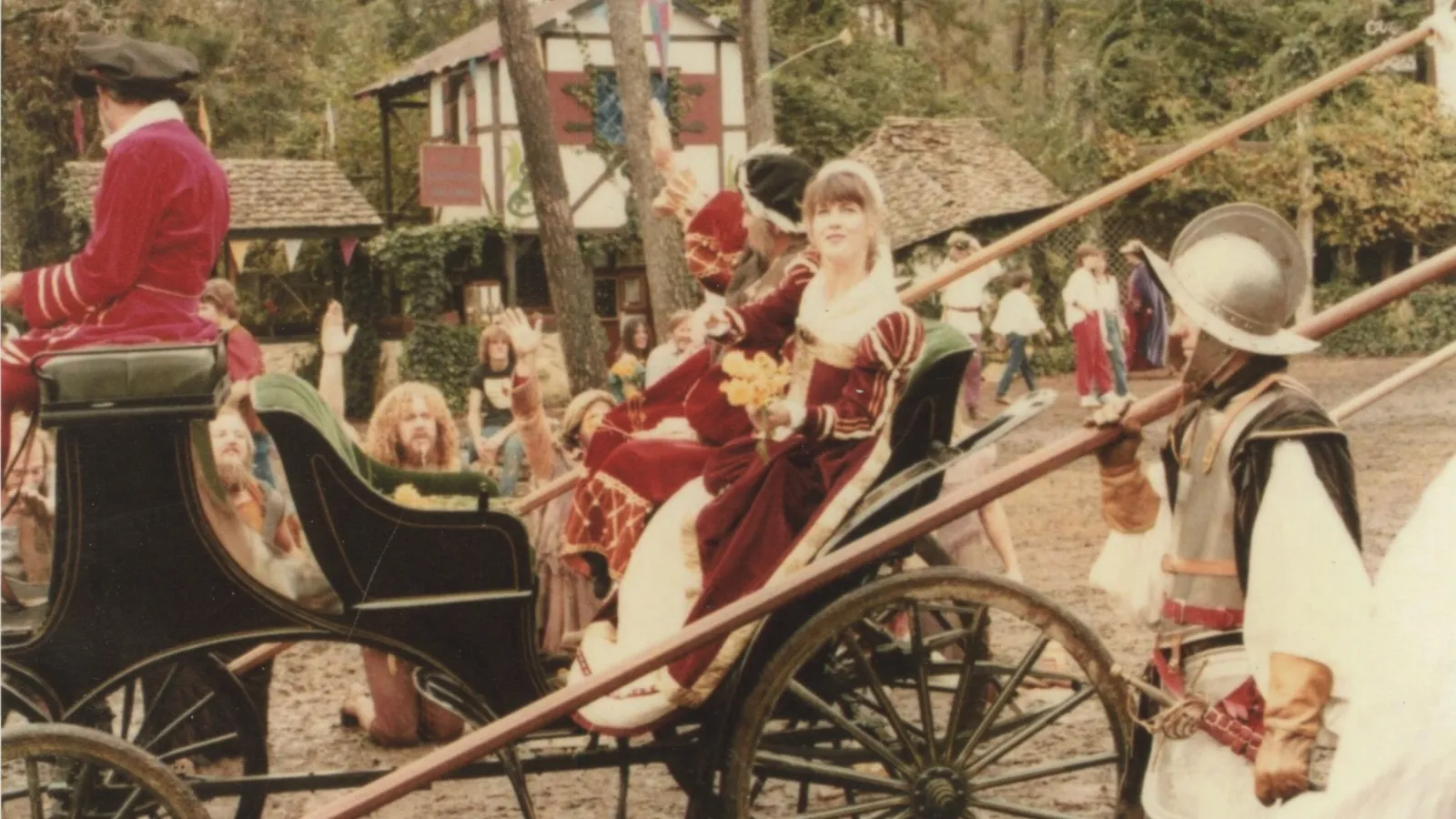 a group of people riding on the back of a horse drawn carriage
