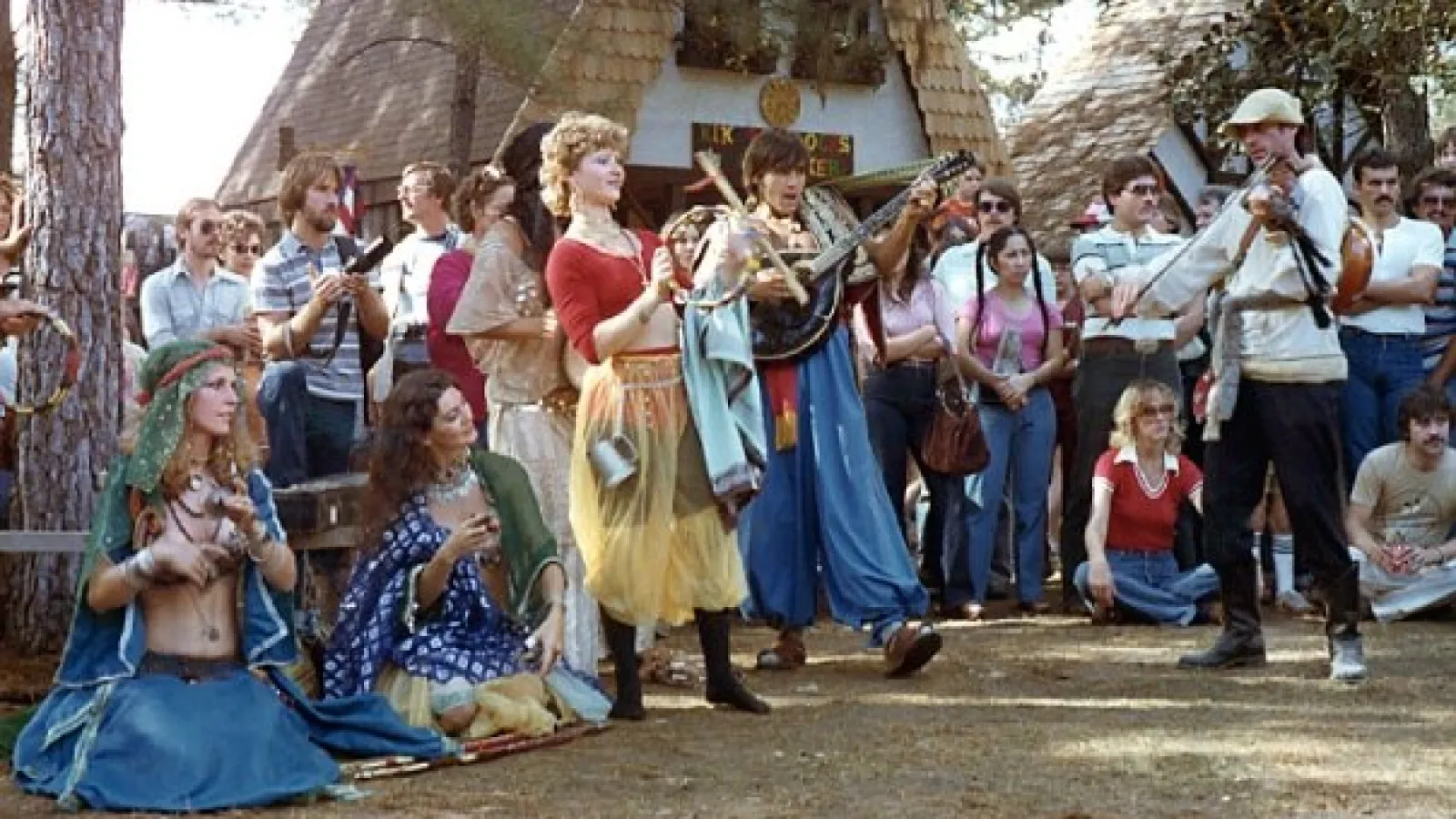a group of people standing in front of a crowd