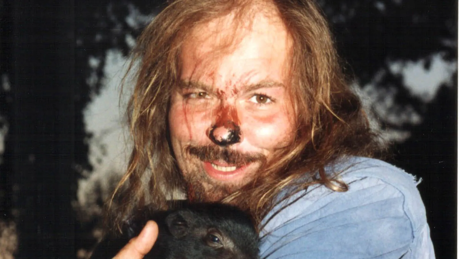 a person holding a cat